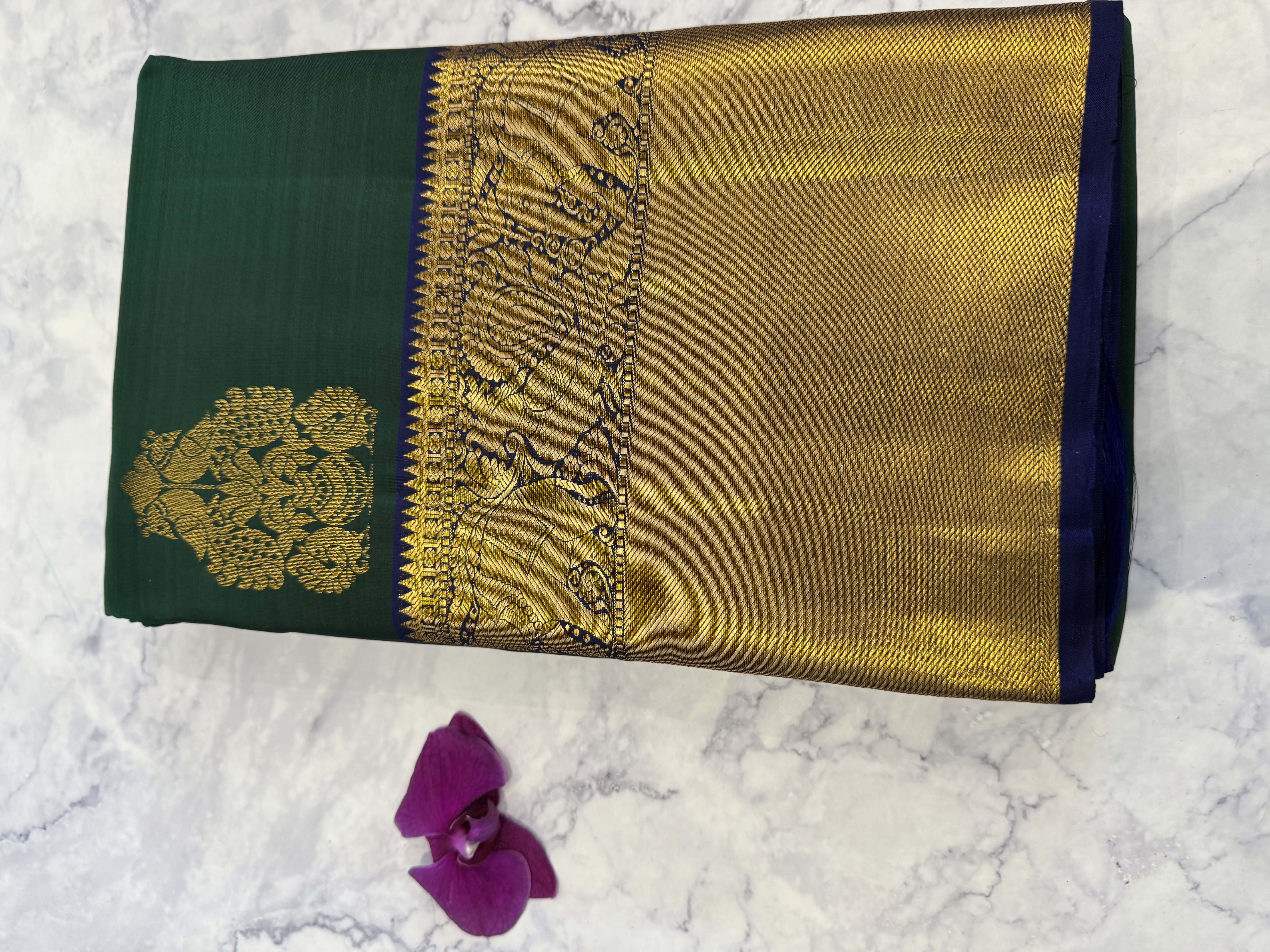 Forest green pure silk saree with navy blue blouse