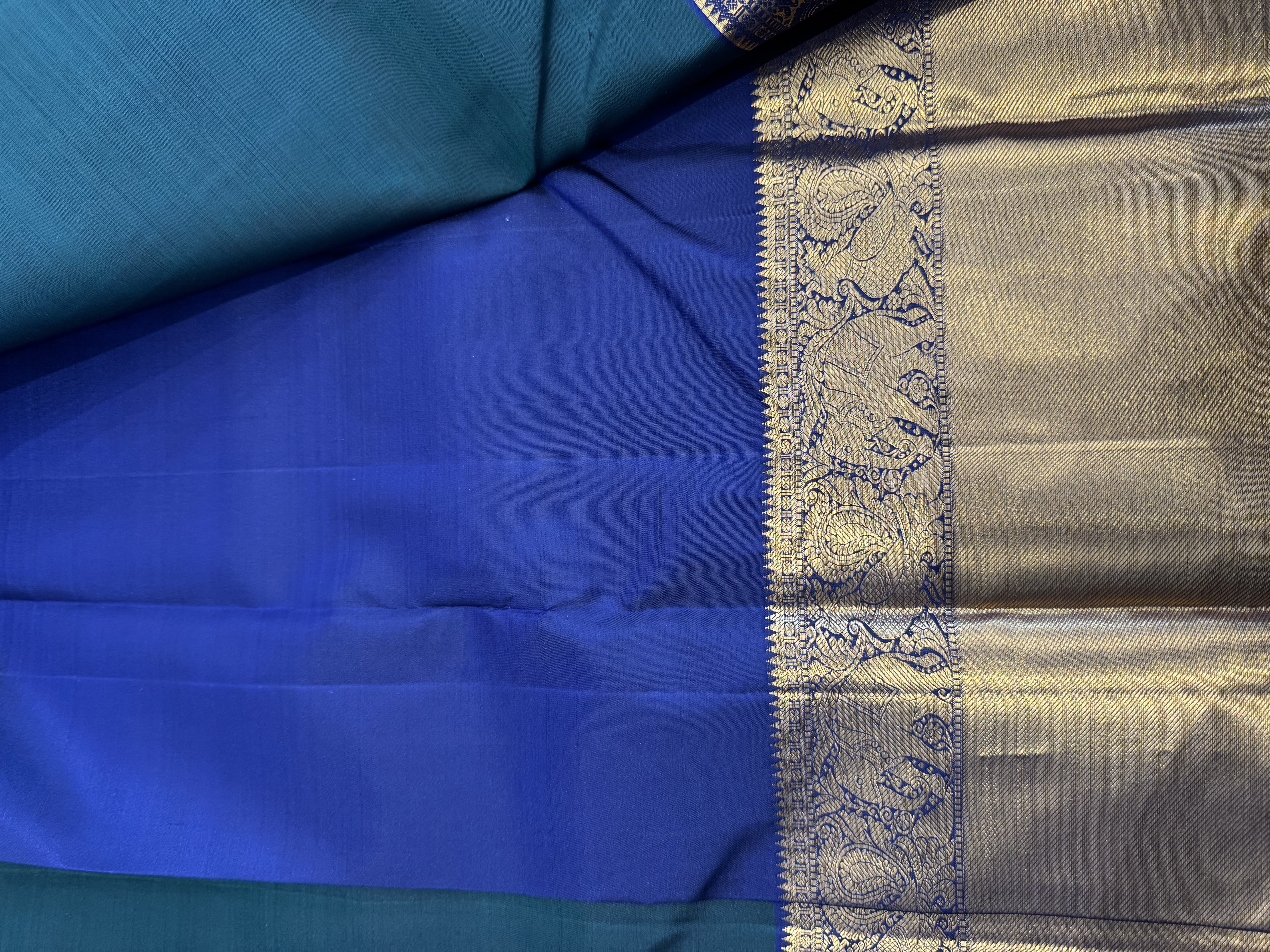 Forest green pure silk saree with navy blue blouse