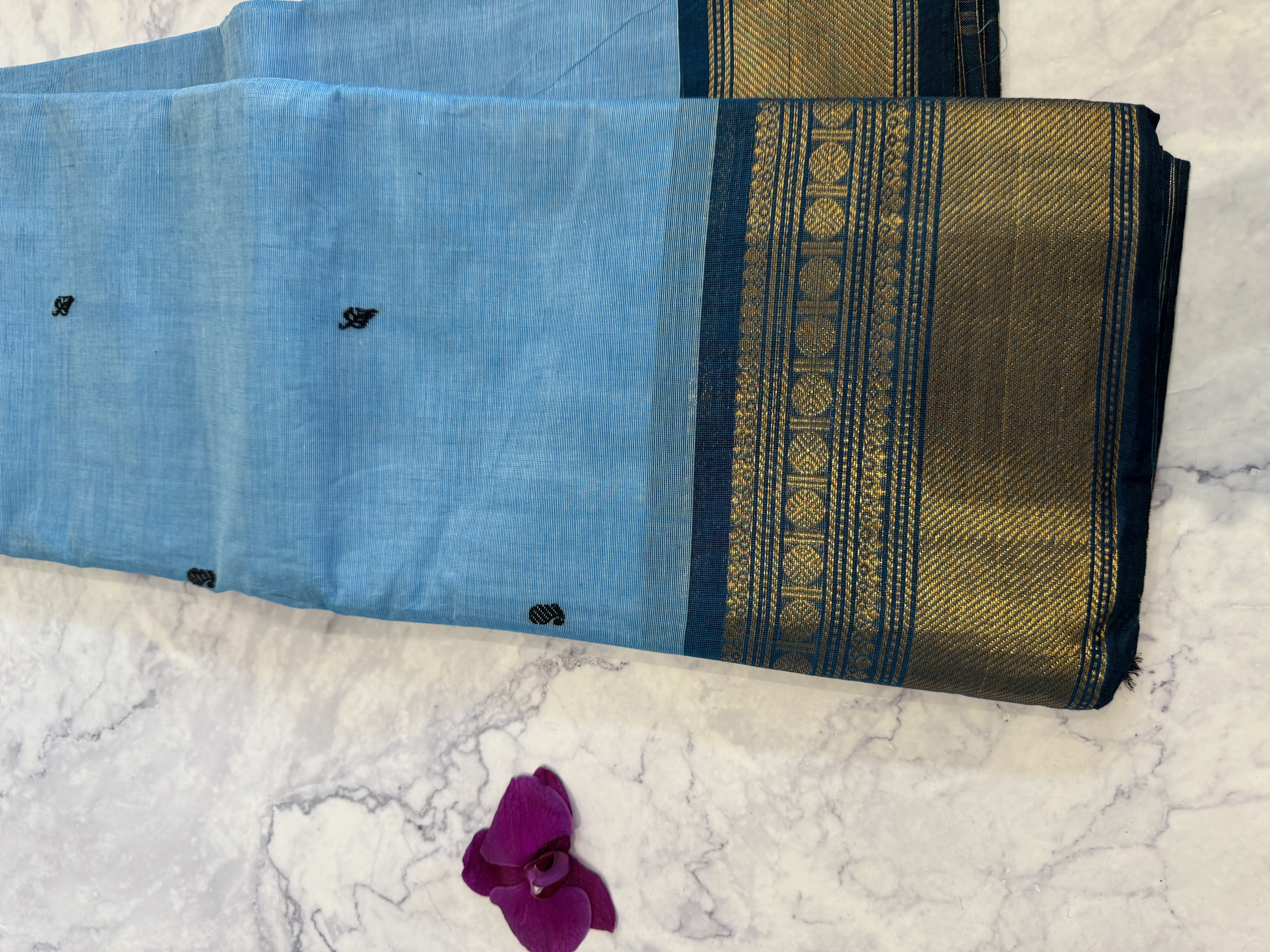 Baby blue cotton saree with teal border