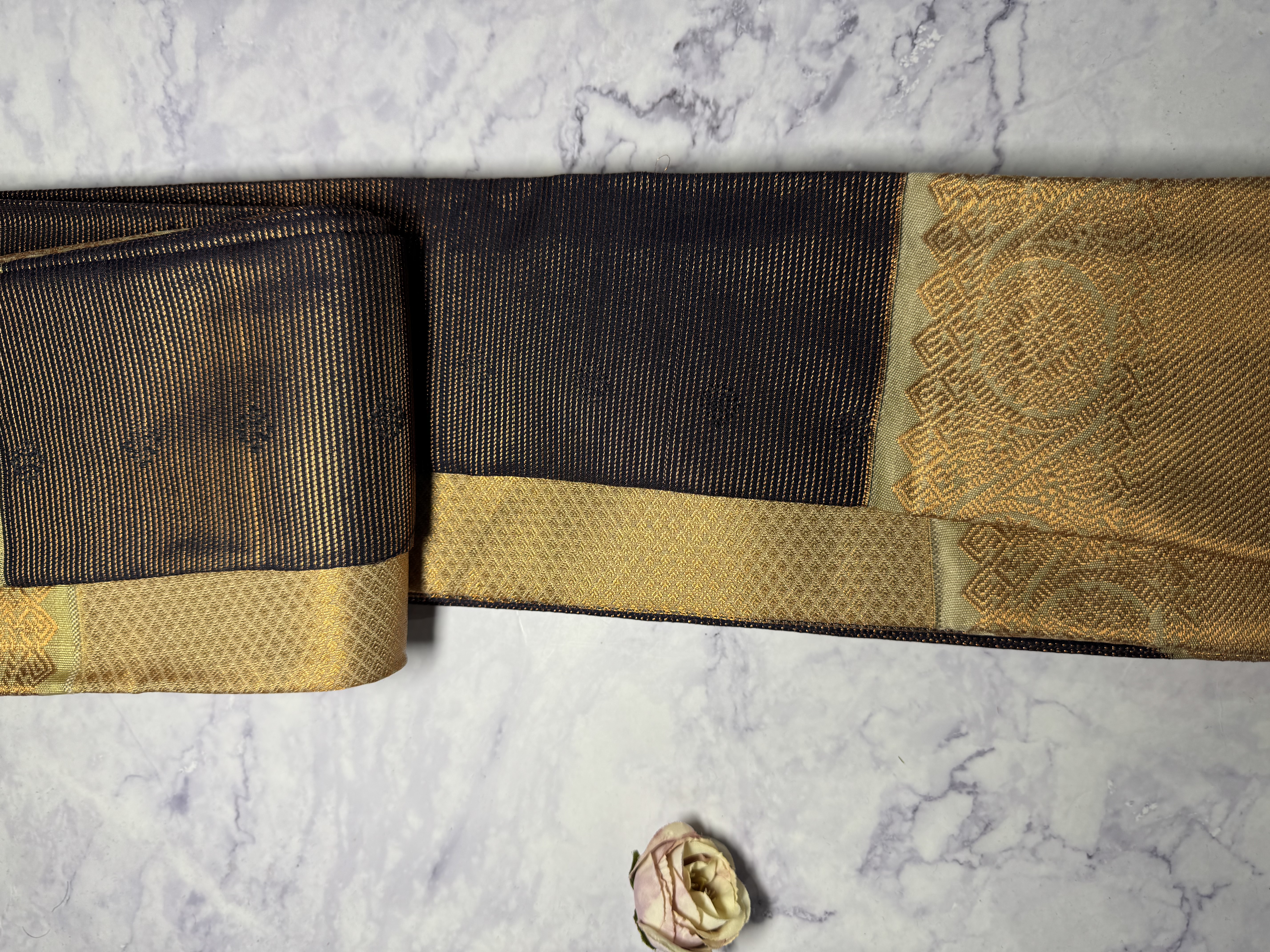 Navy blue vaira oosi saree with sage green border and copper work