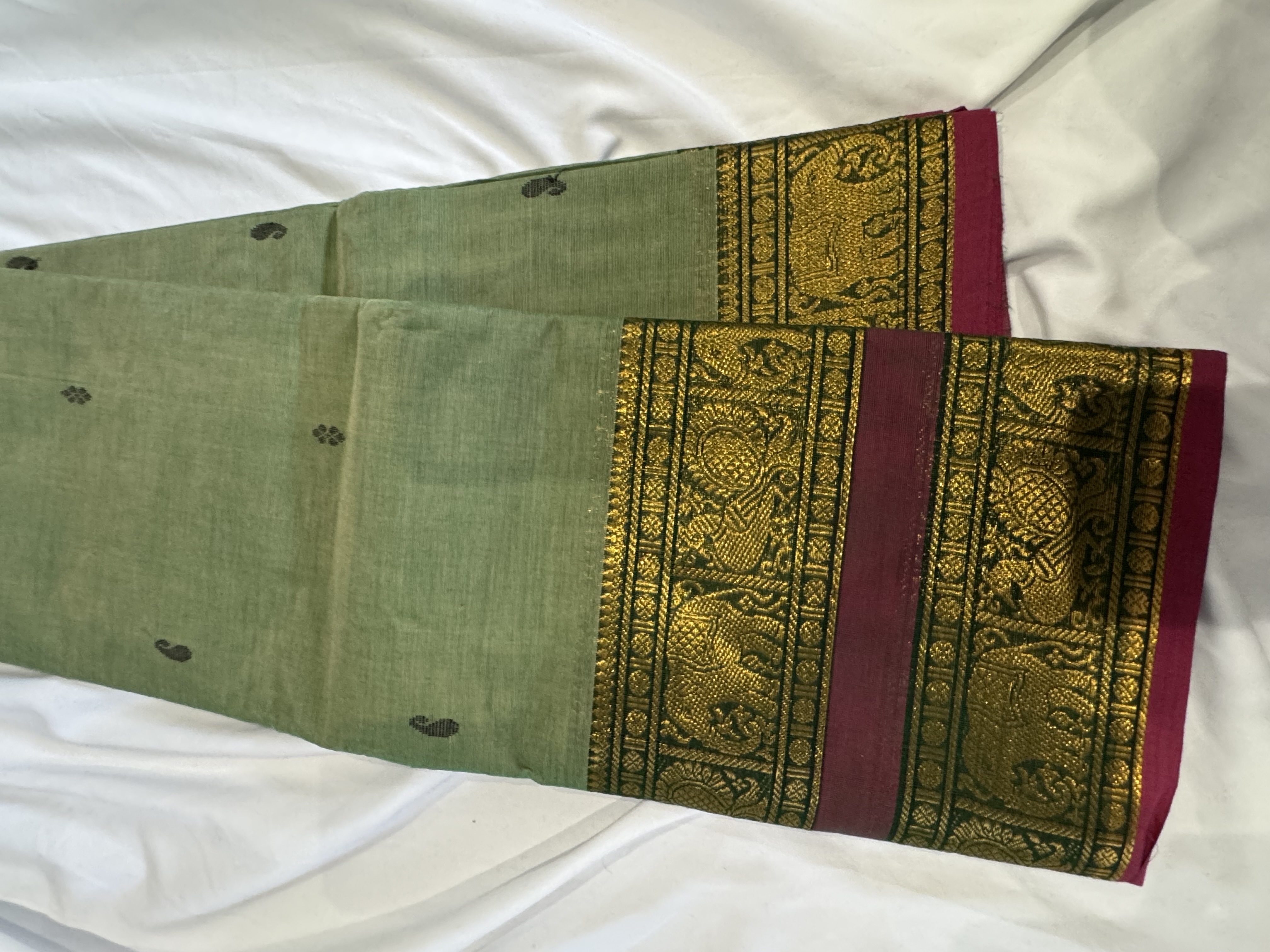 Pastel green cotton saree with pink border