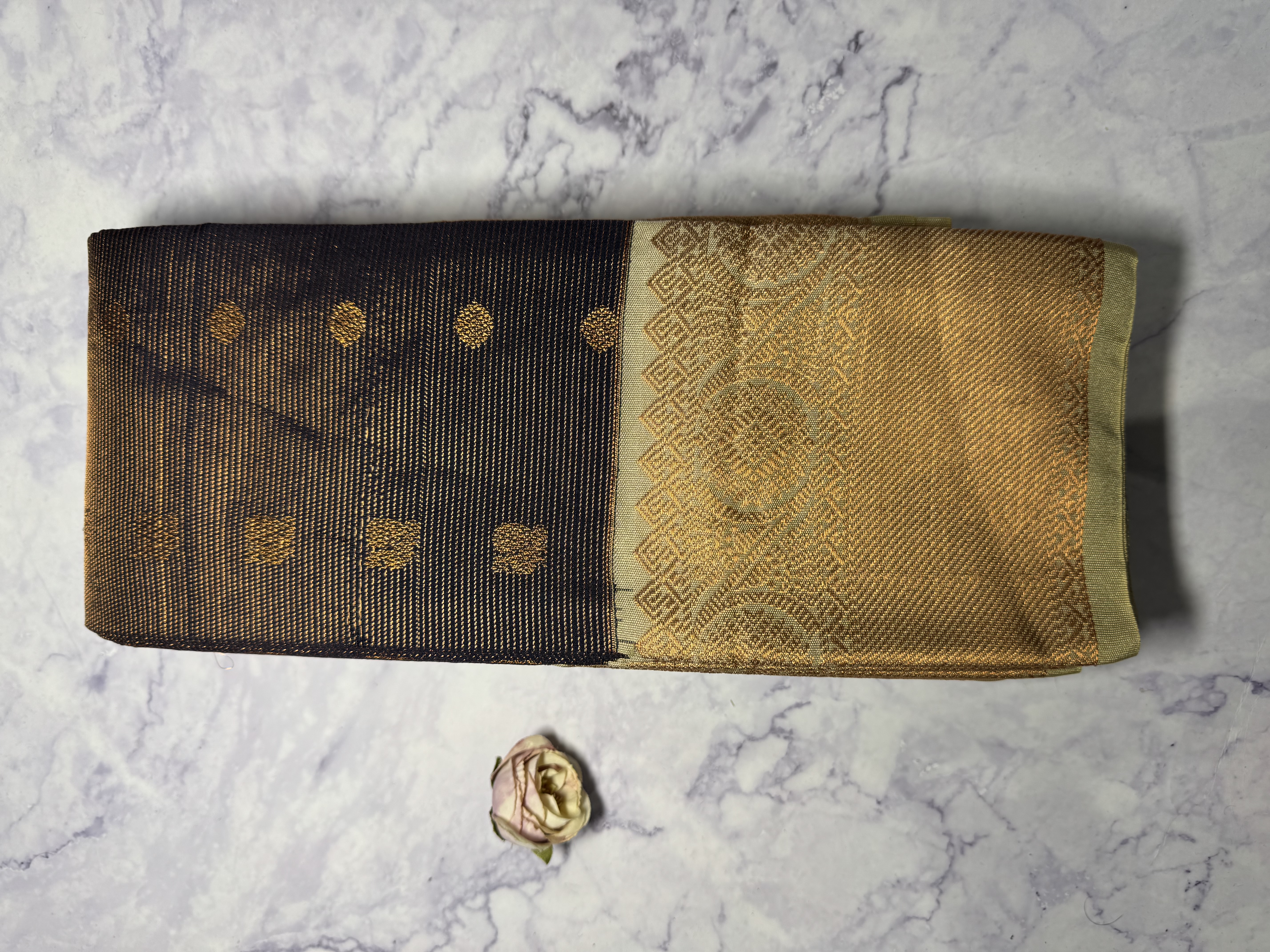 Navy blue vaira oosi saree with sage green border and copper work