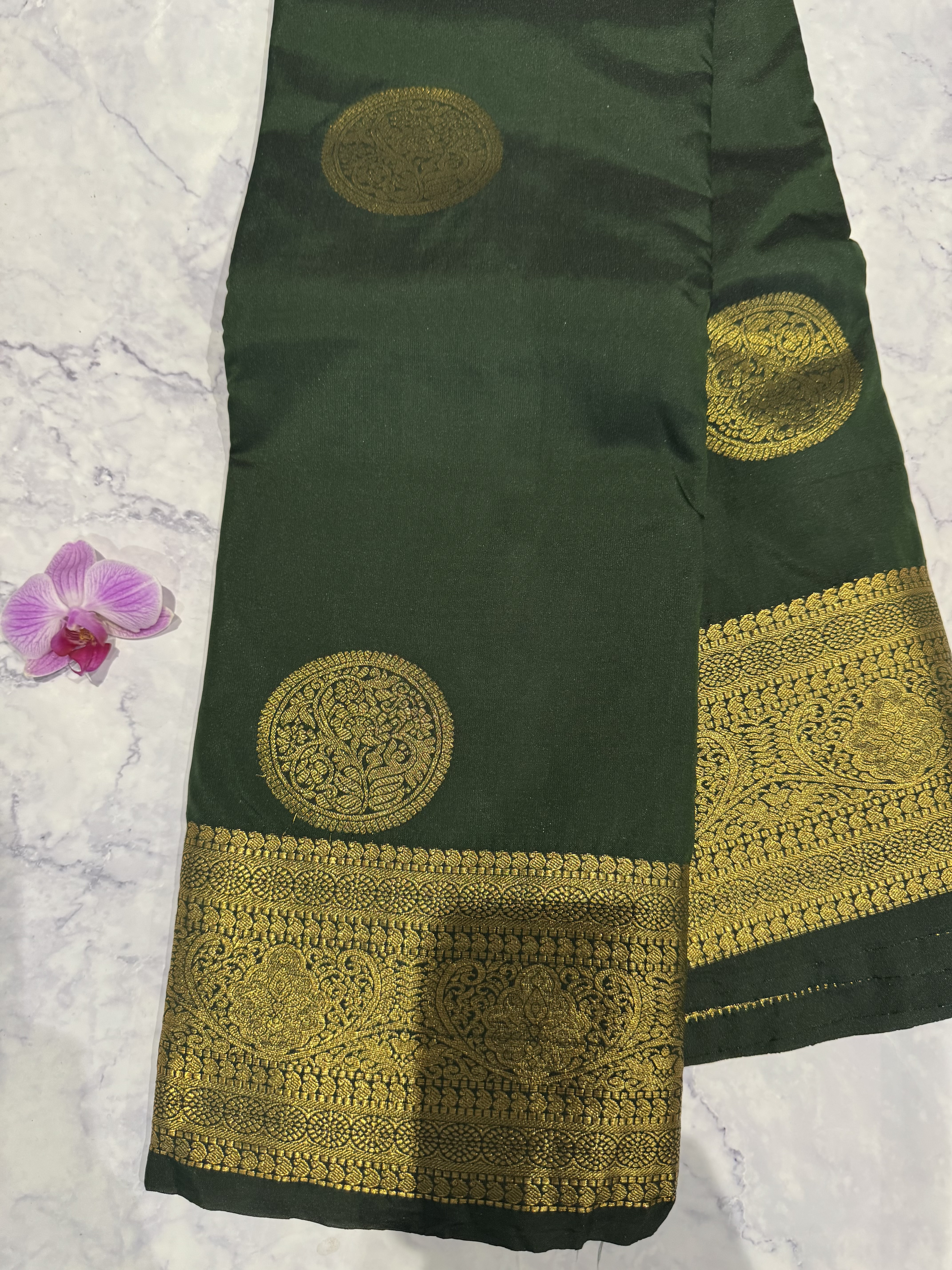 Forest green semi silk saree with round butta