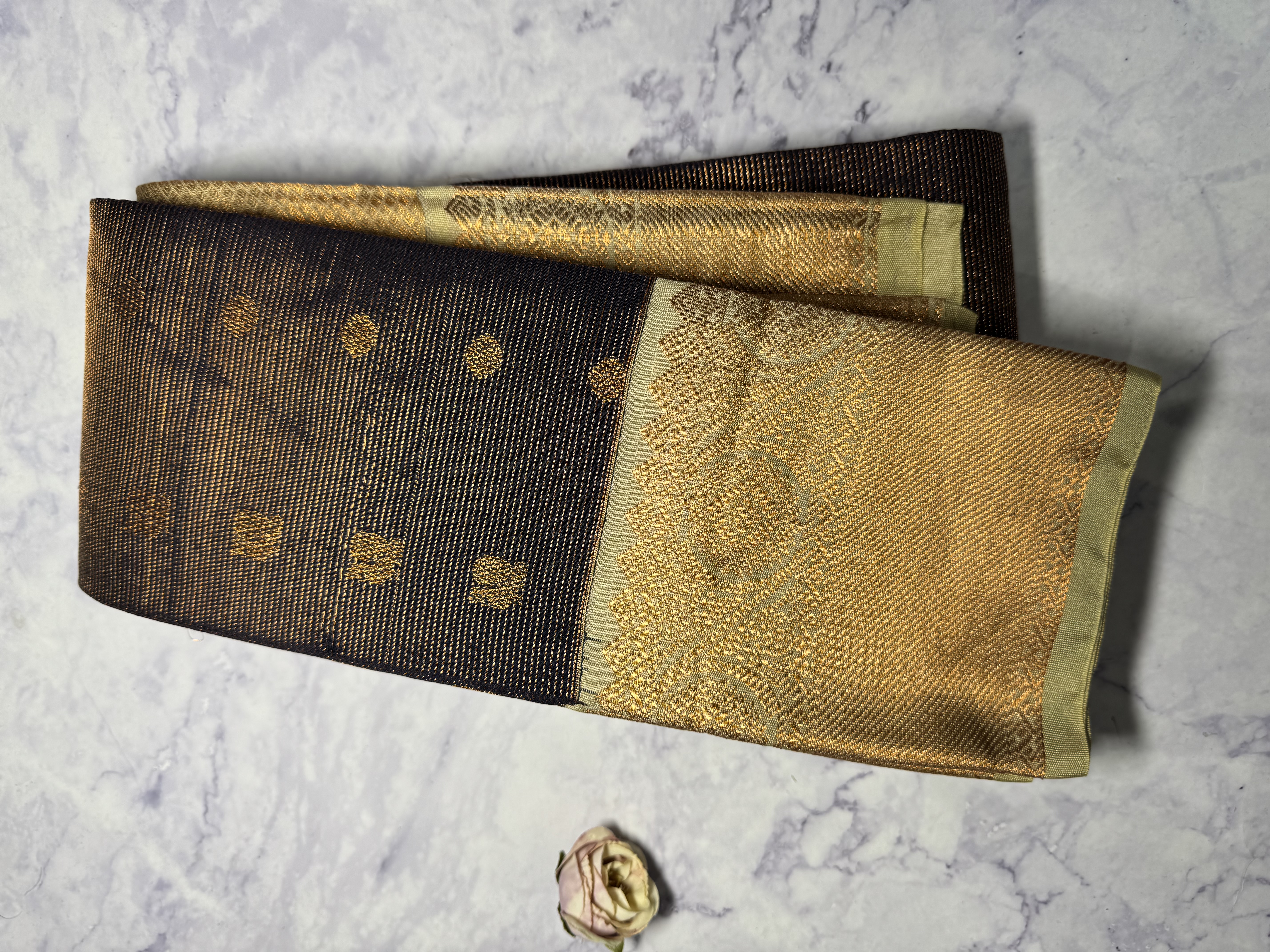 Navy blue vaira oosi saree with sage green border and copper work
