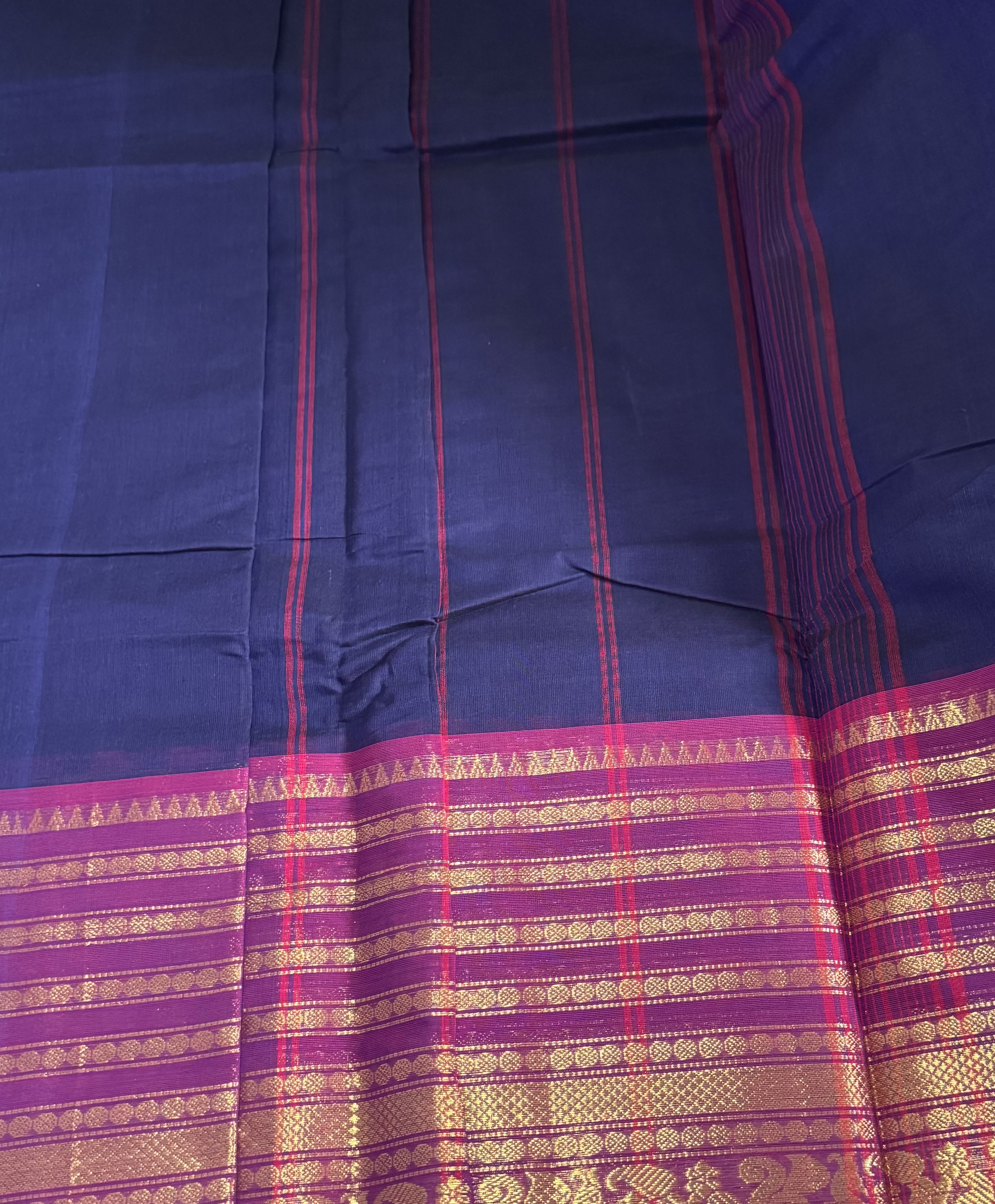 Navy blue cotton saree with pink border