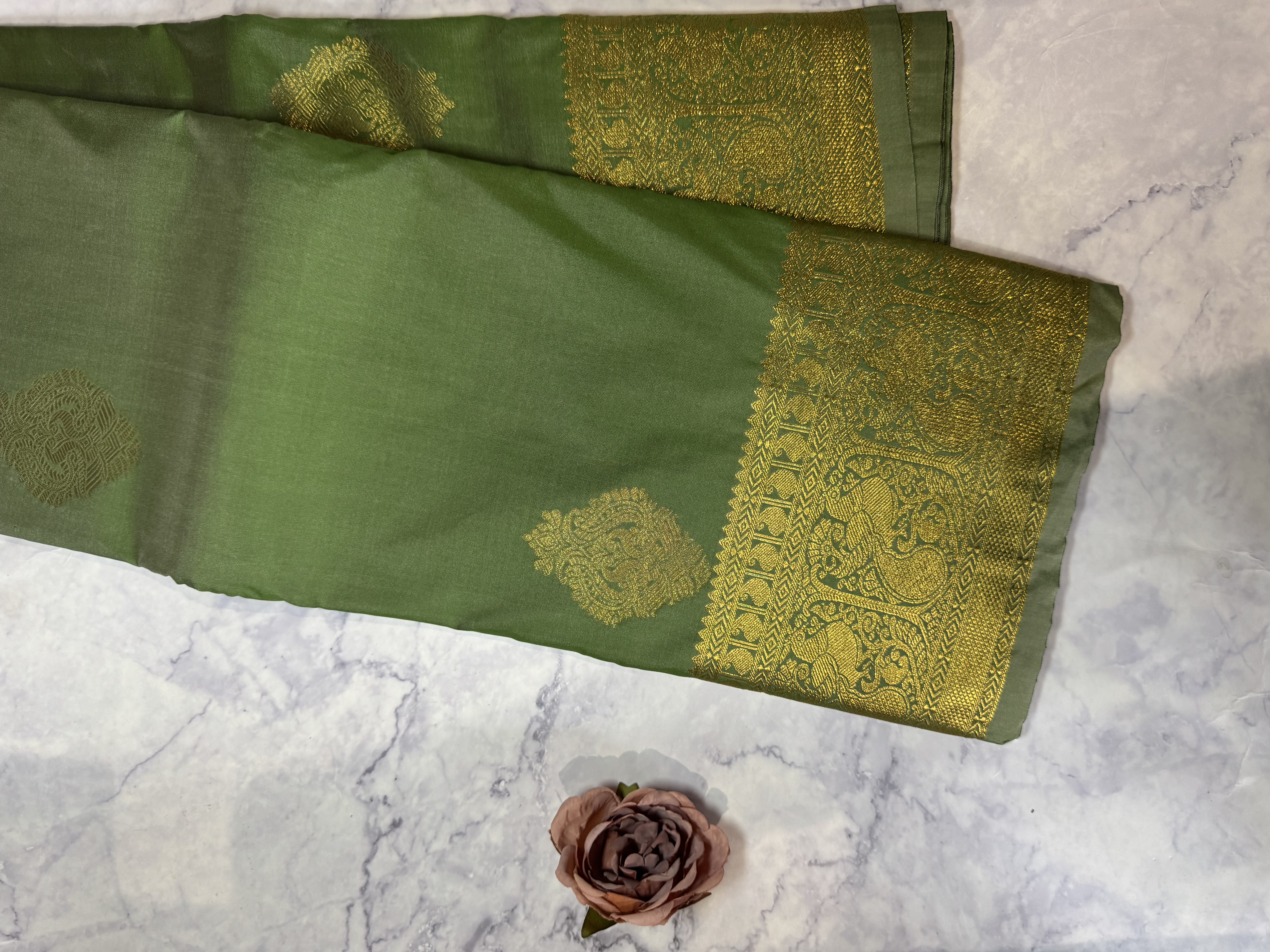 Sage green semi silk saree with medium buttas