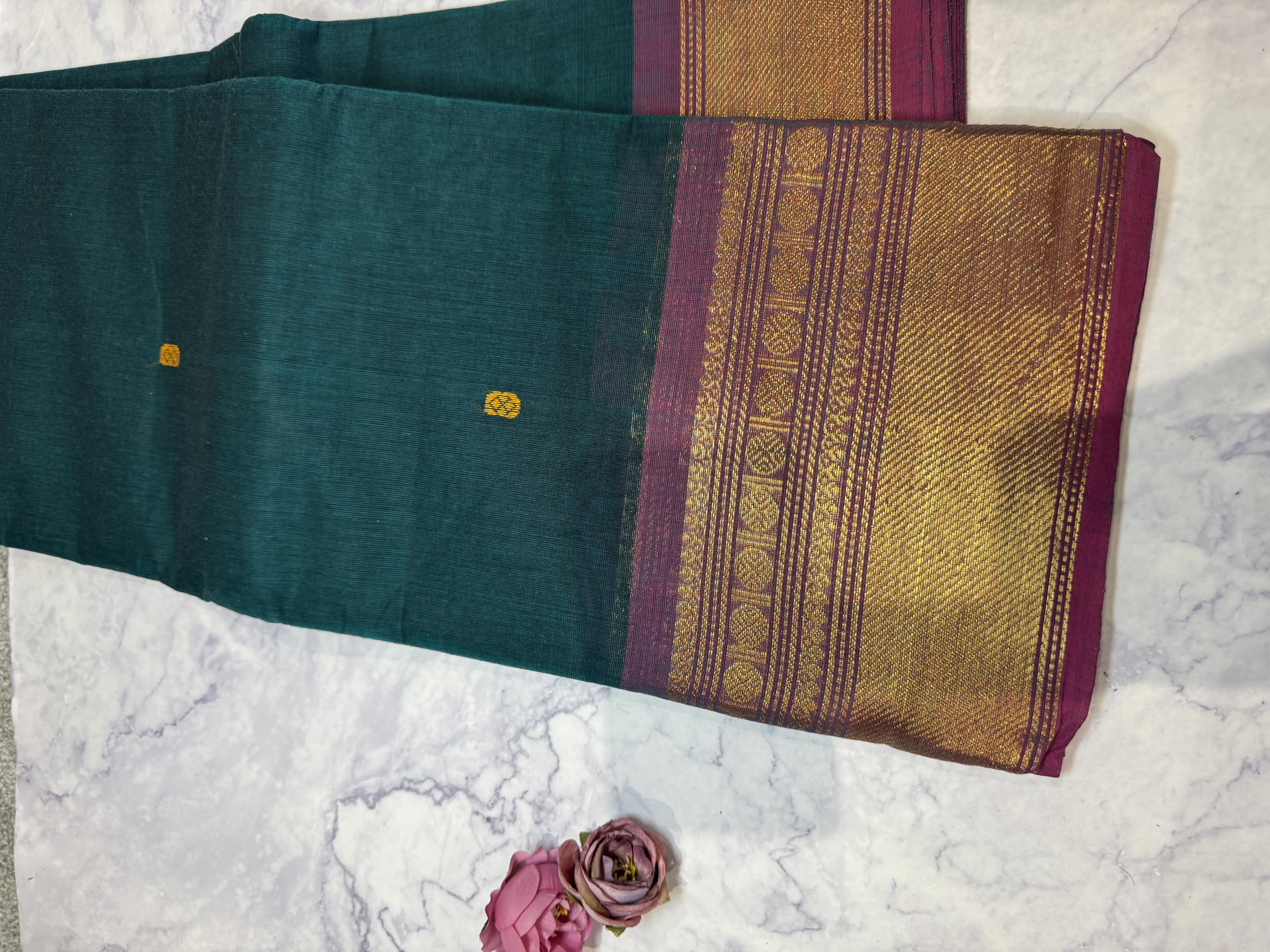 Forest green cotton saree with pink border
