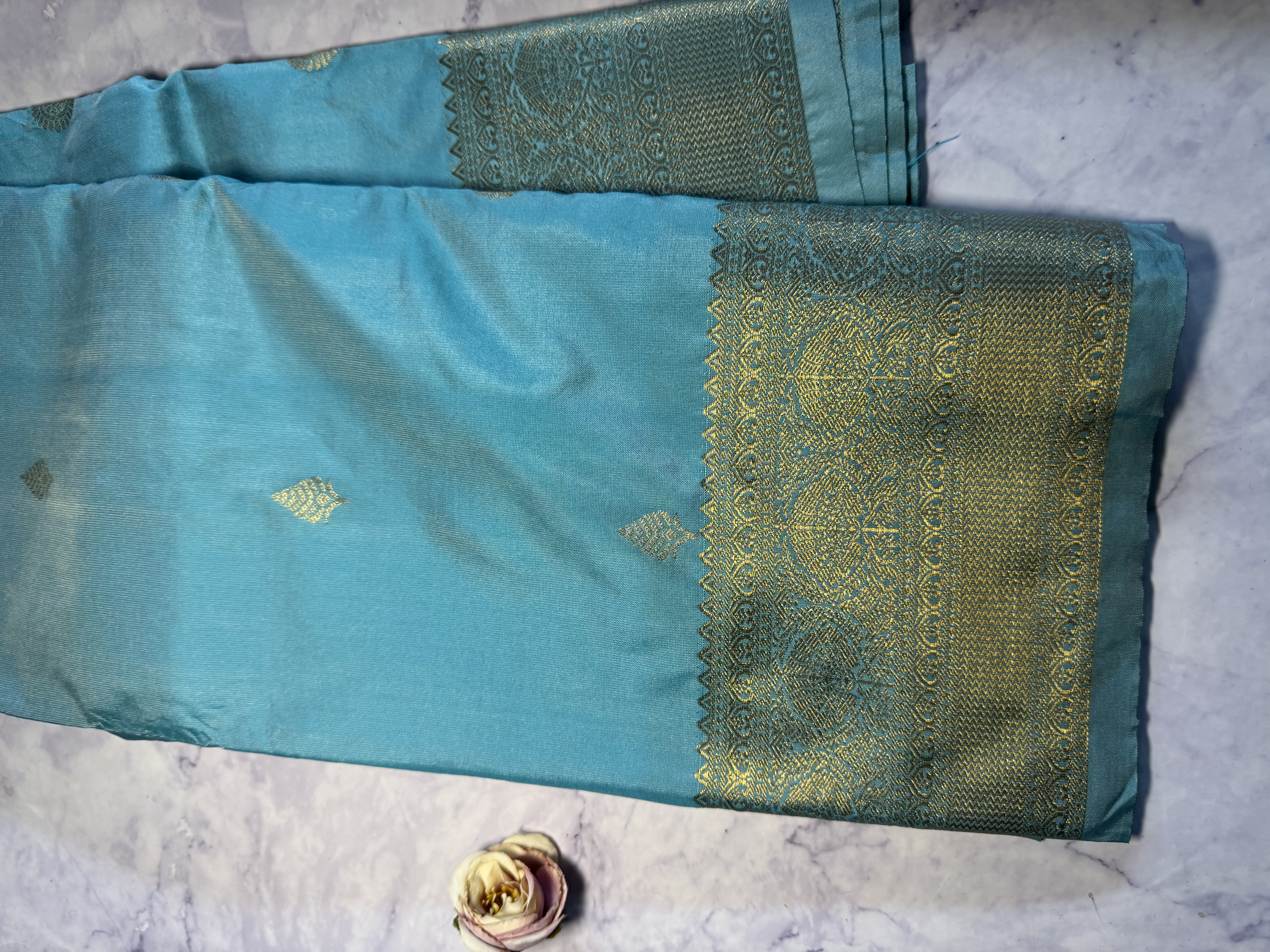 Sky blue semi silk saree with gold zari