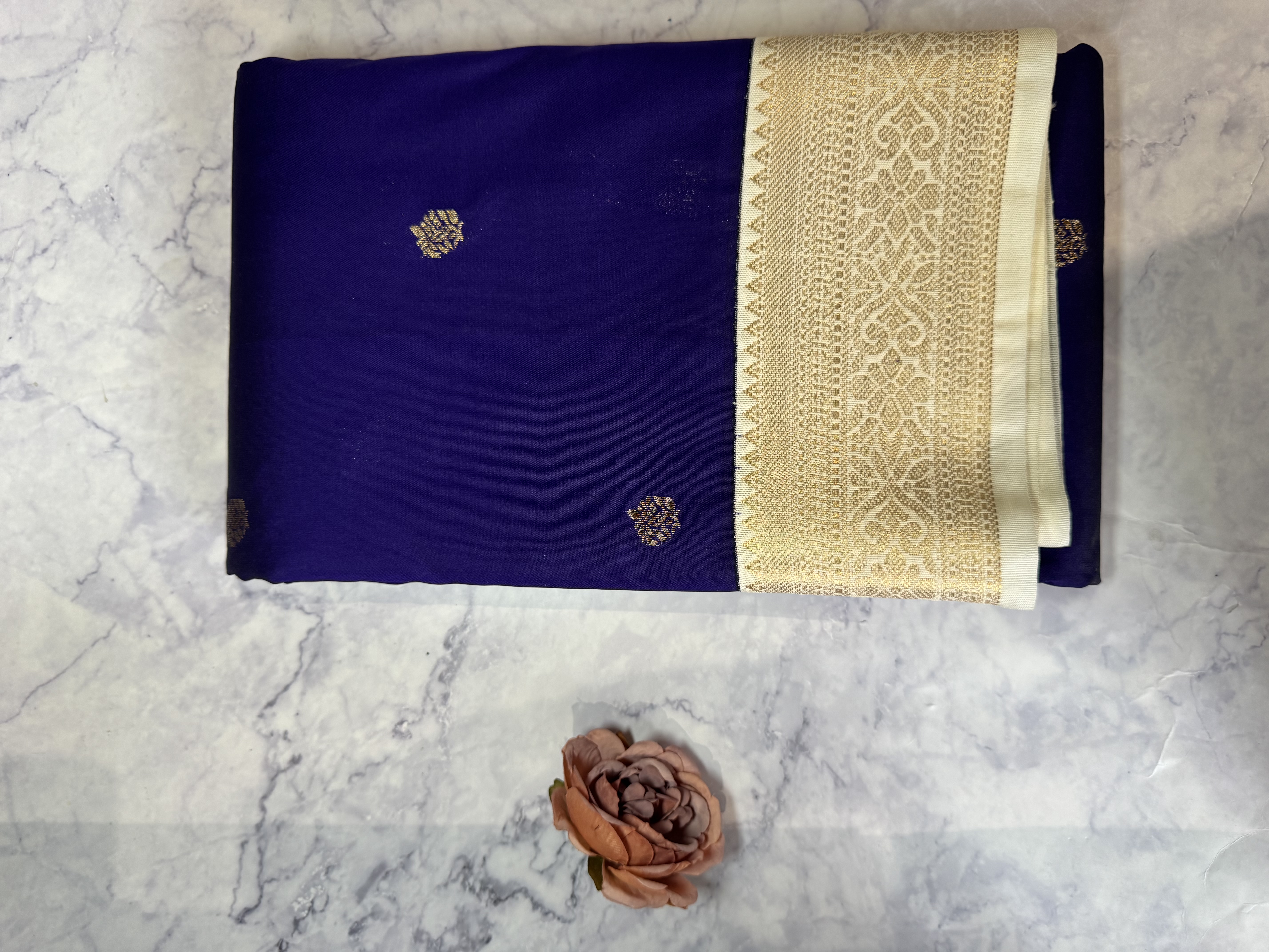 Navy blue semi silk saree with cream blouse