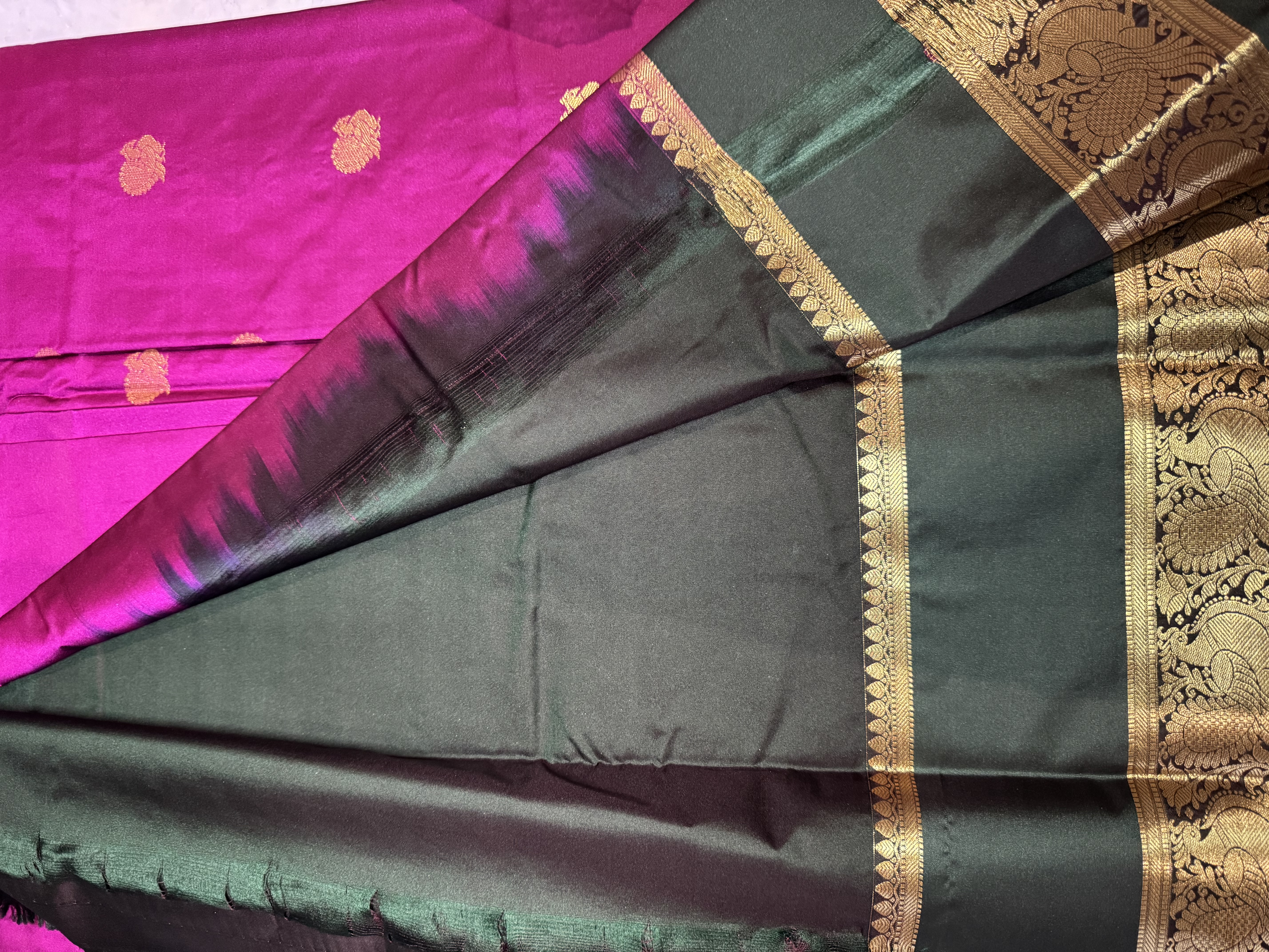 Magenta semi silk saree with emerald green gap border