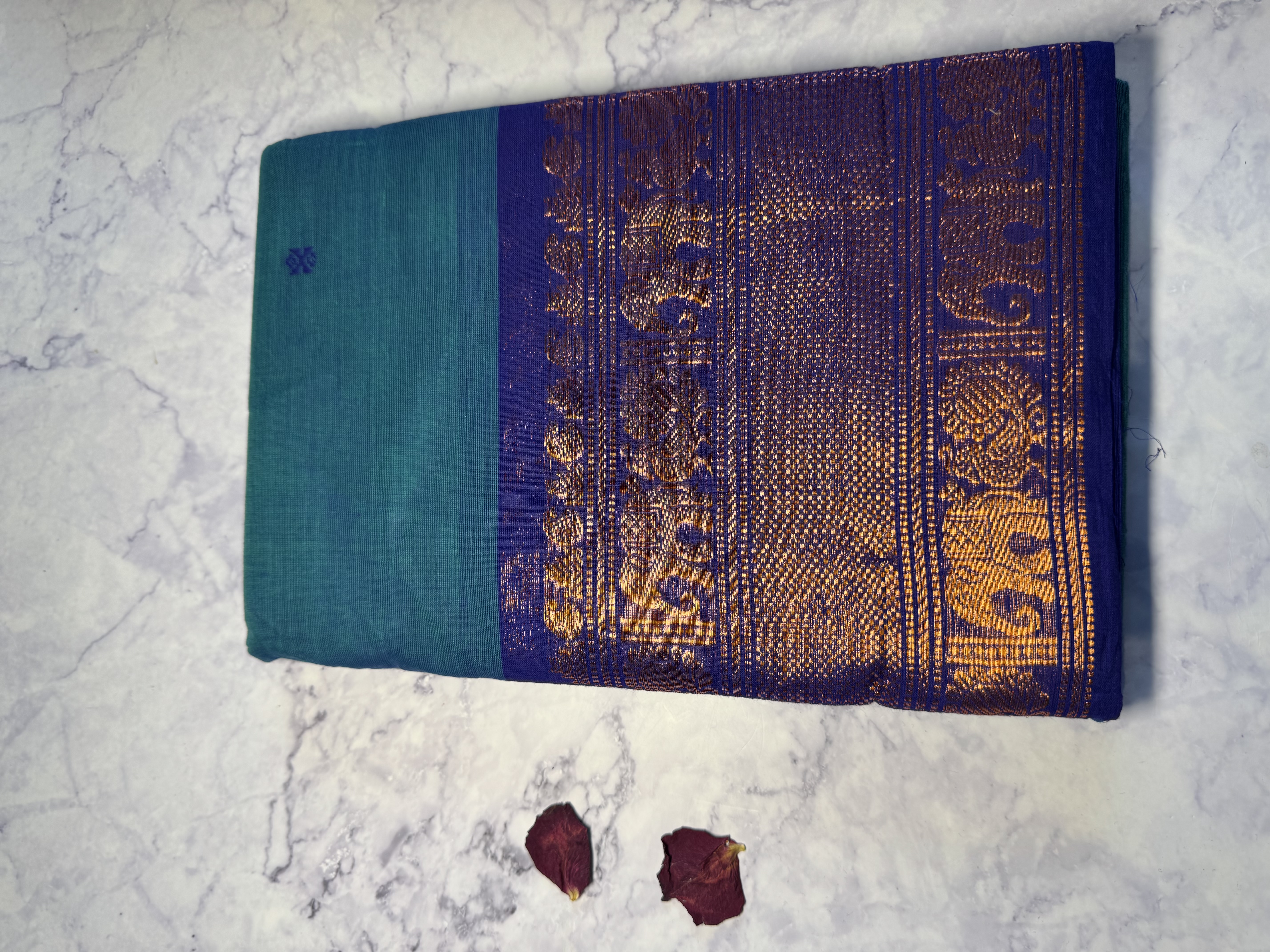 Teal cotton saree with navy border and copper zari