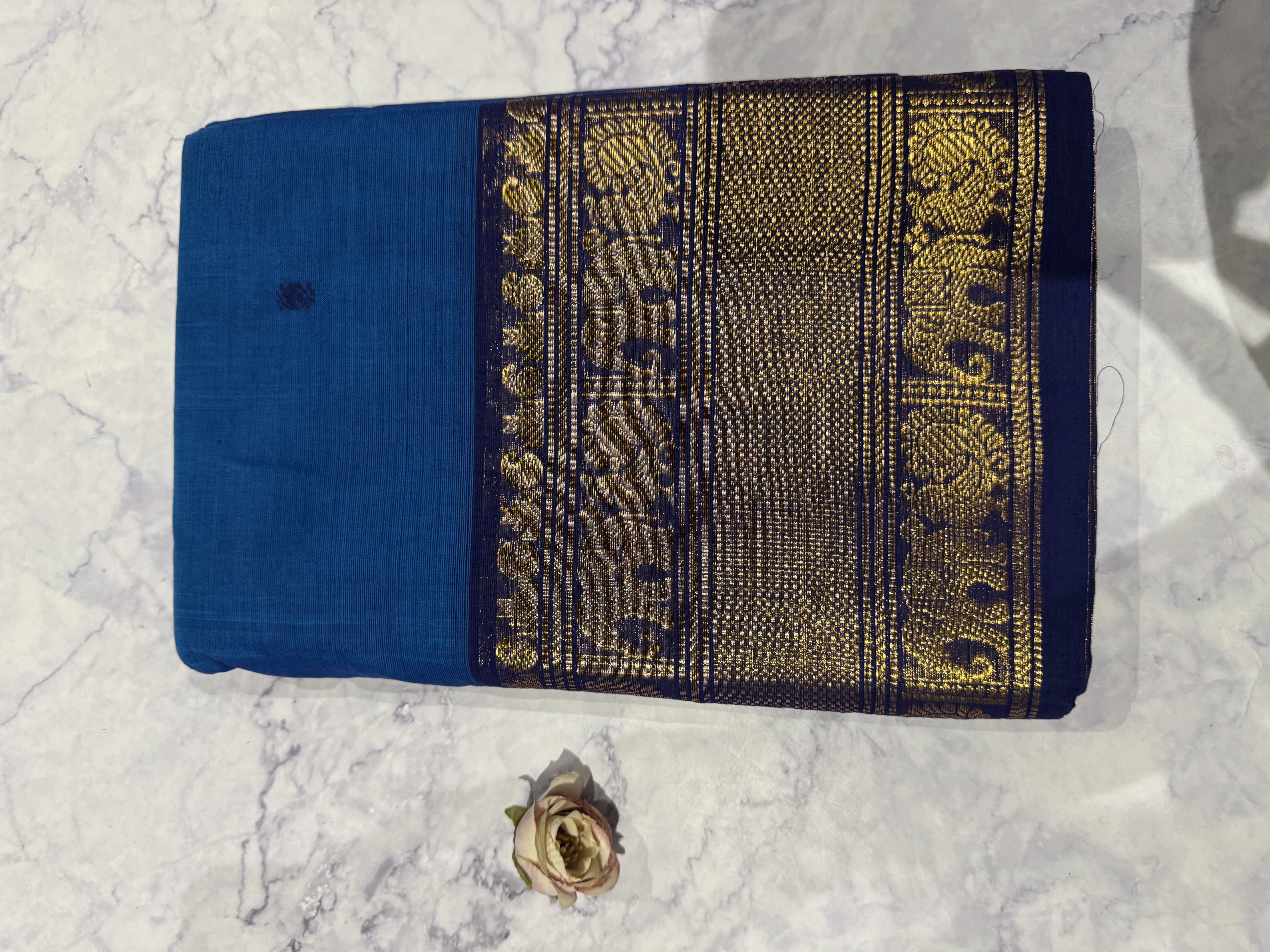 Bright blue cotton saree with navy blue border