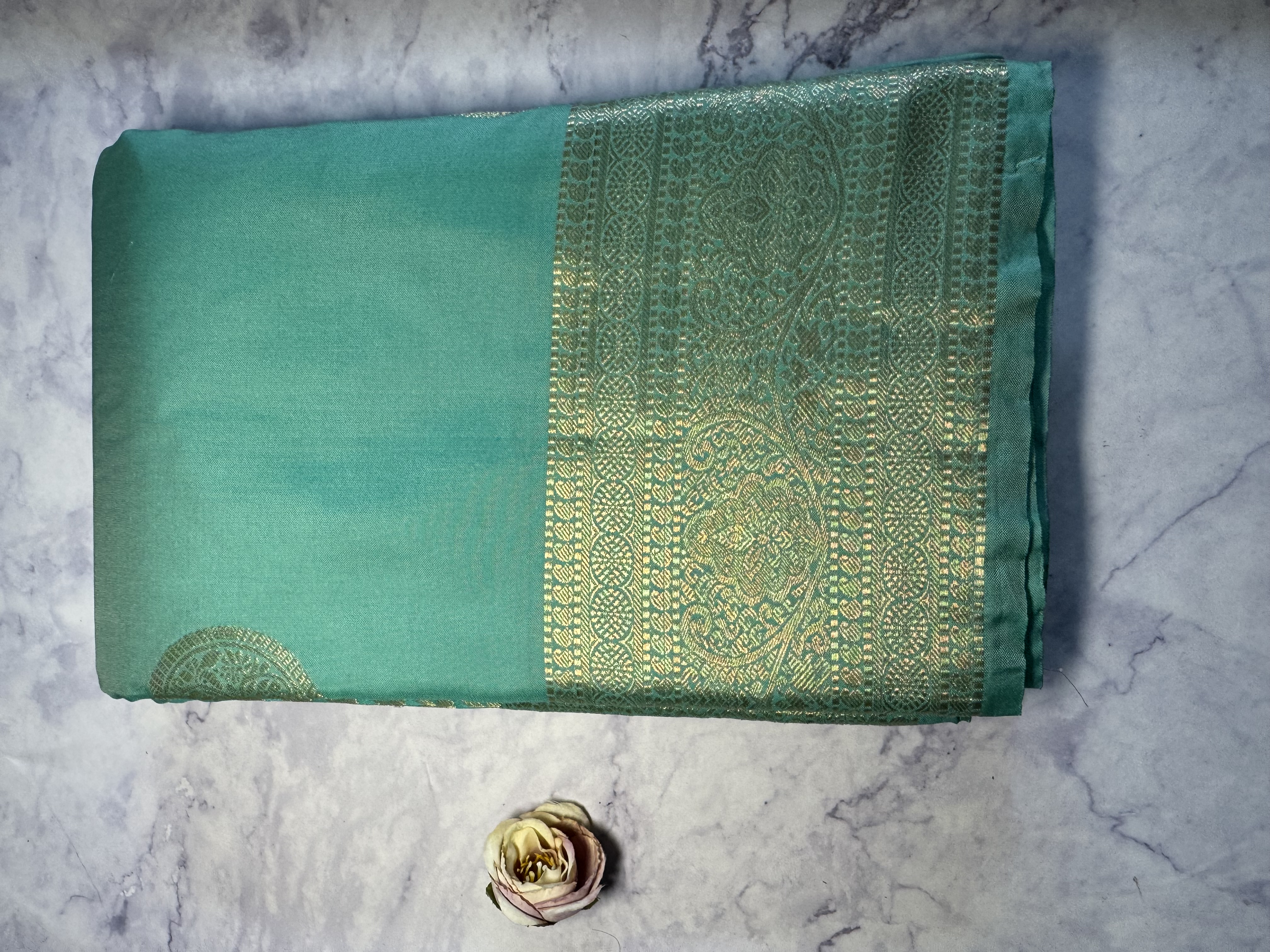 Aqua blue semi silk saree with round buttas 