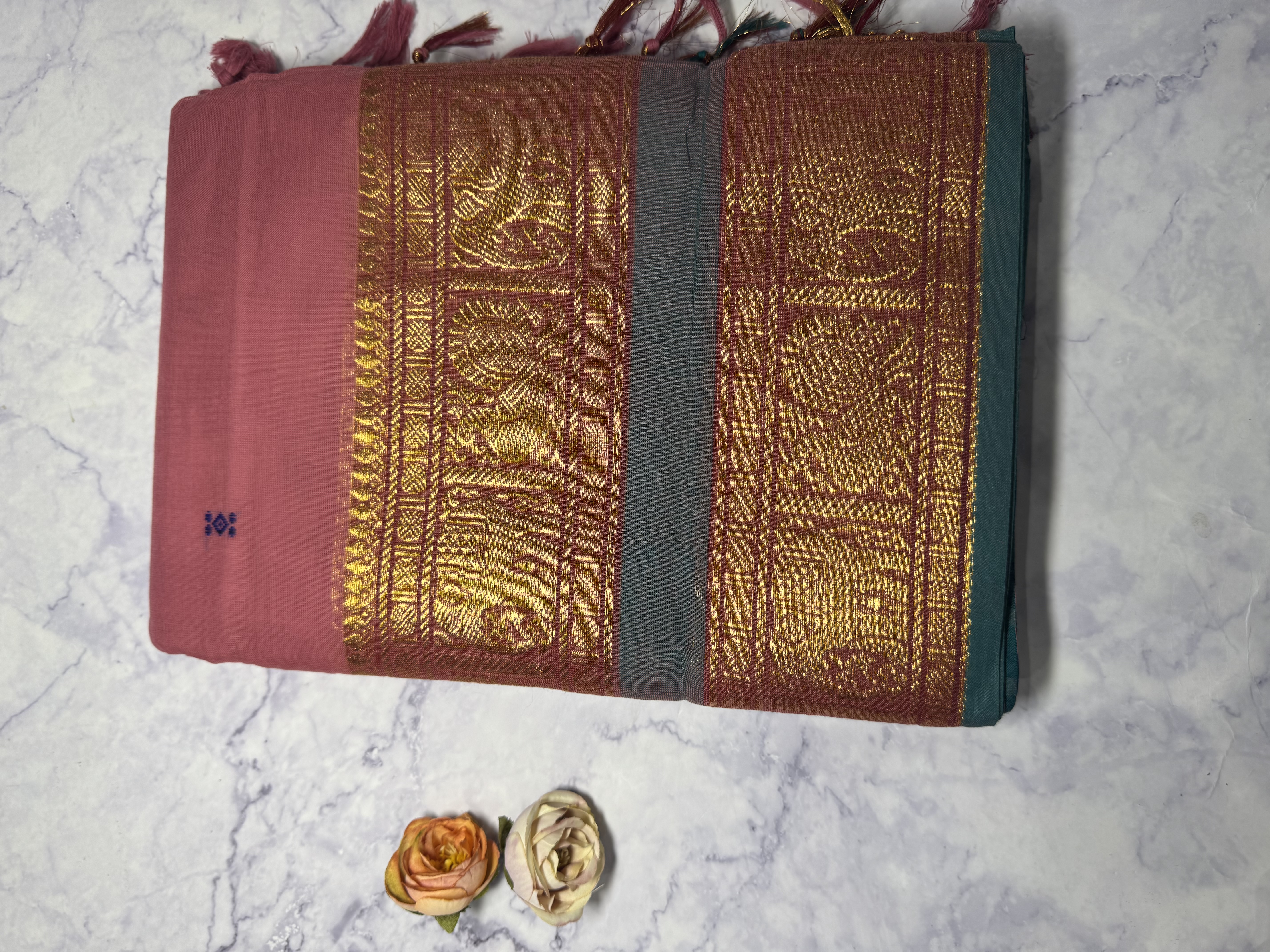Pastel pink cotton saree with blue green border