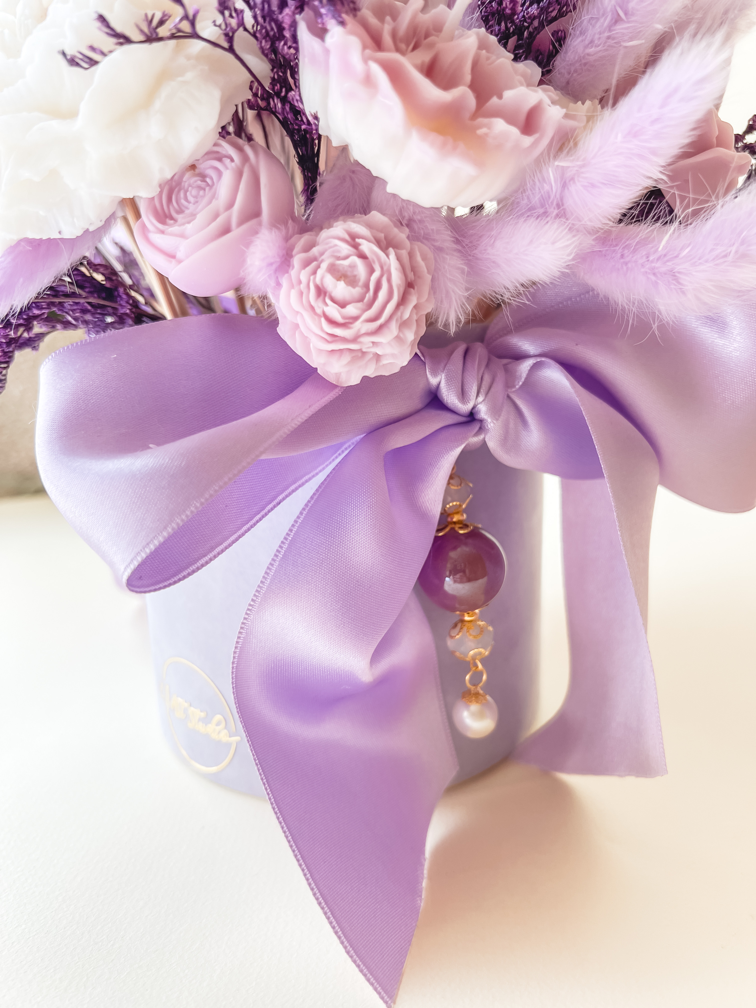 Žvakių žiedų puokštė "Alyvų aušra"