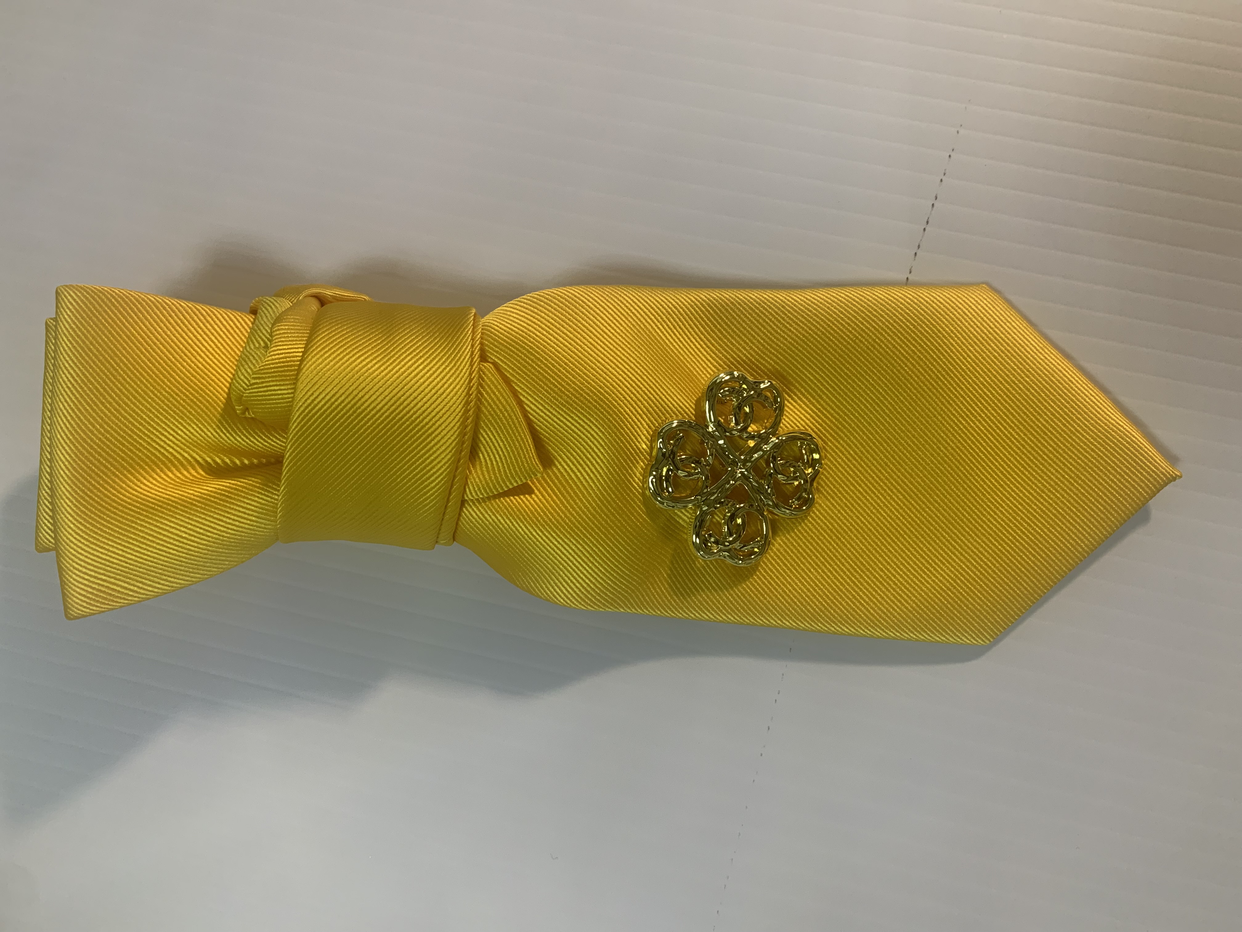 Elegant Yellow Necktie with Floral Brooch