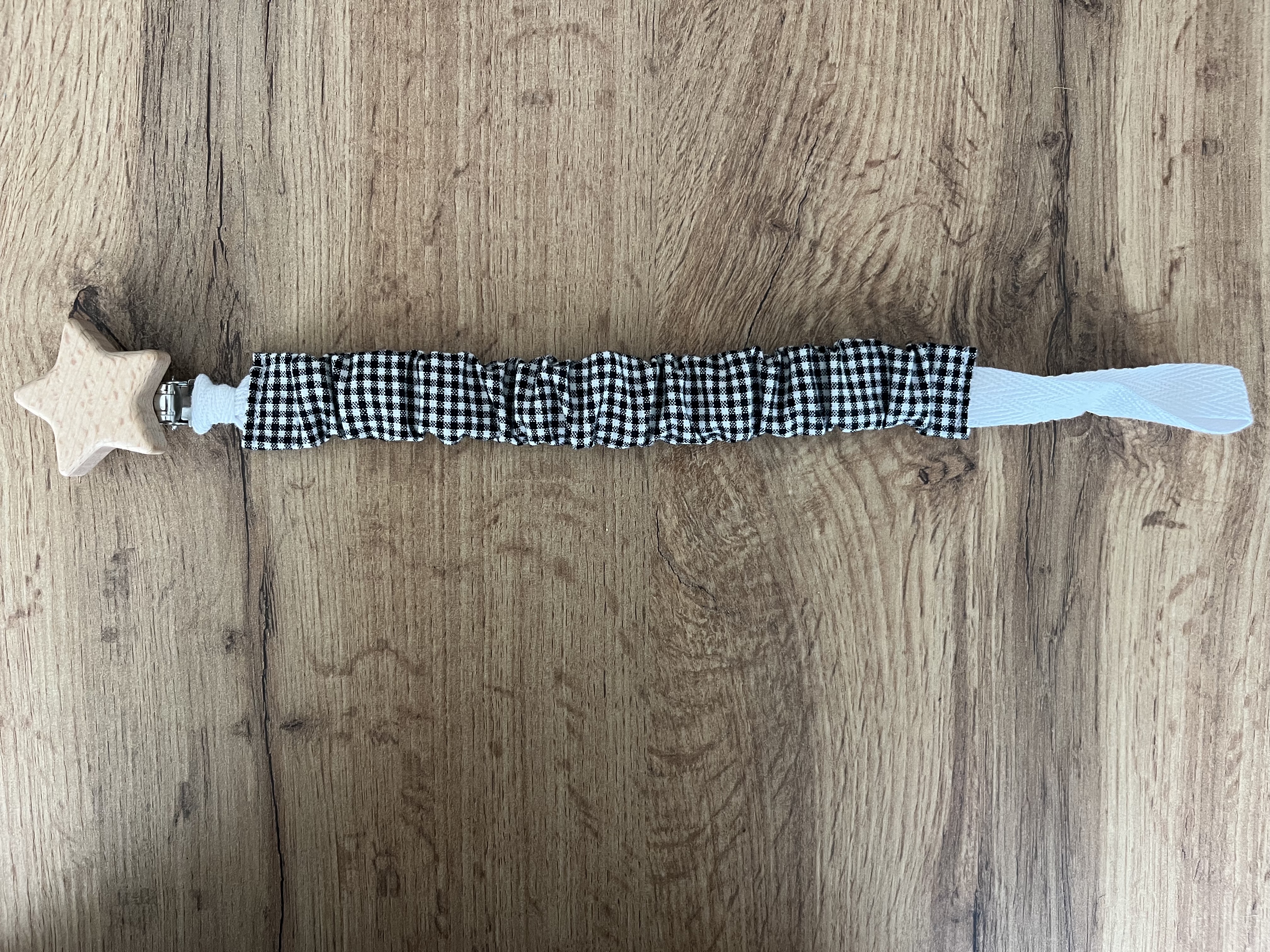 Cuelga chupetes cuadros negros