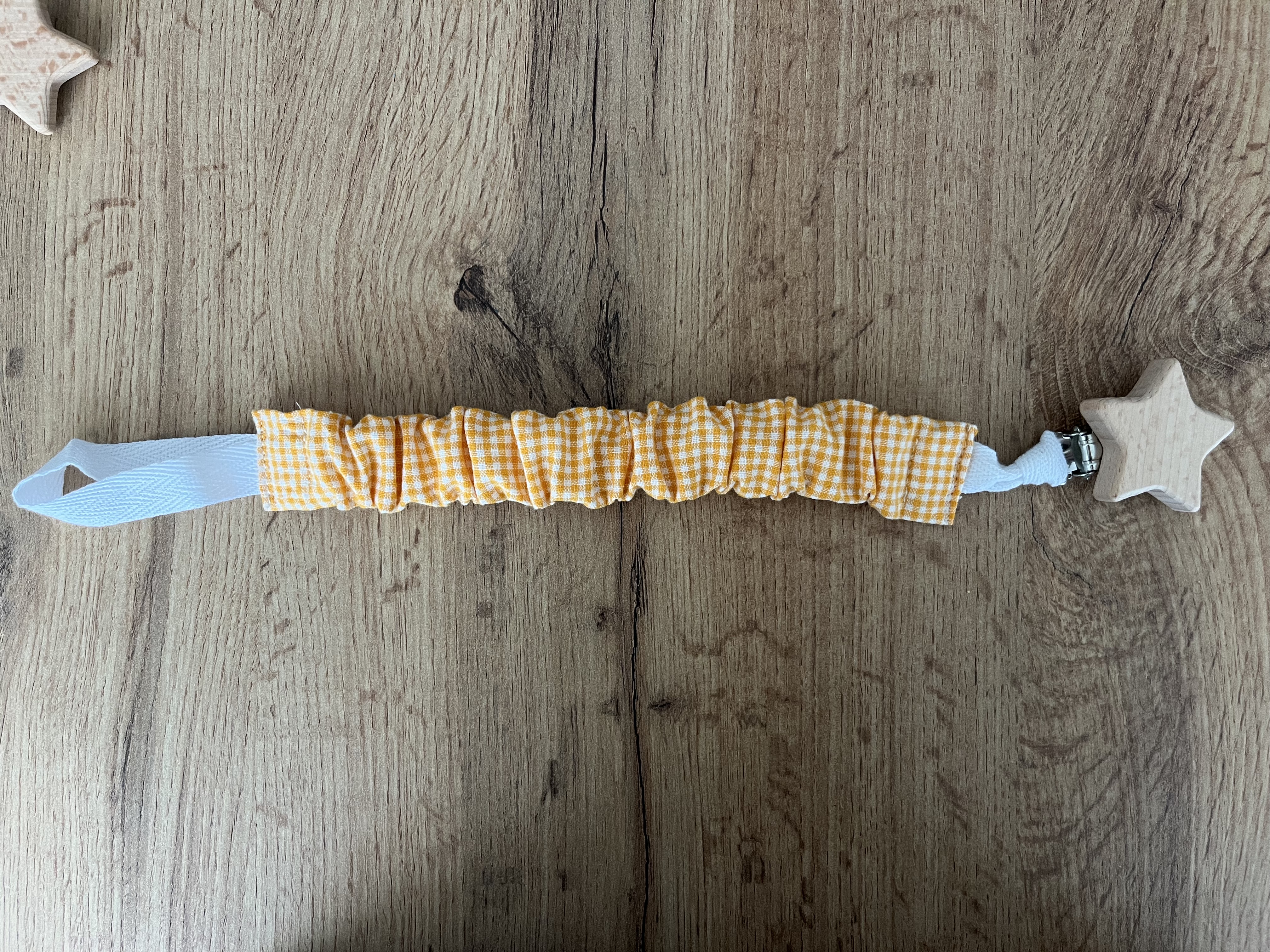 Cuelga chupetes cuadros naranja