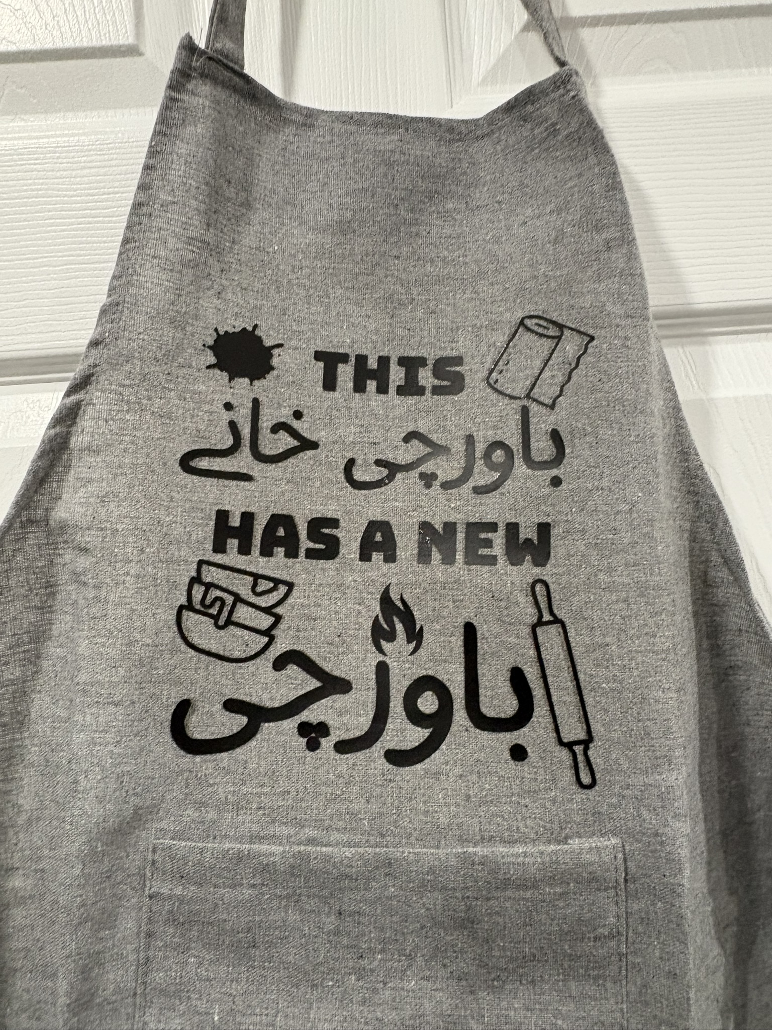 Funny Kitchen Apron in Urdu,  This Bawarchi khana has a new Bawarchi
