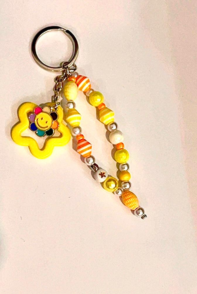 Llavero de flor sonriente