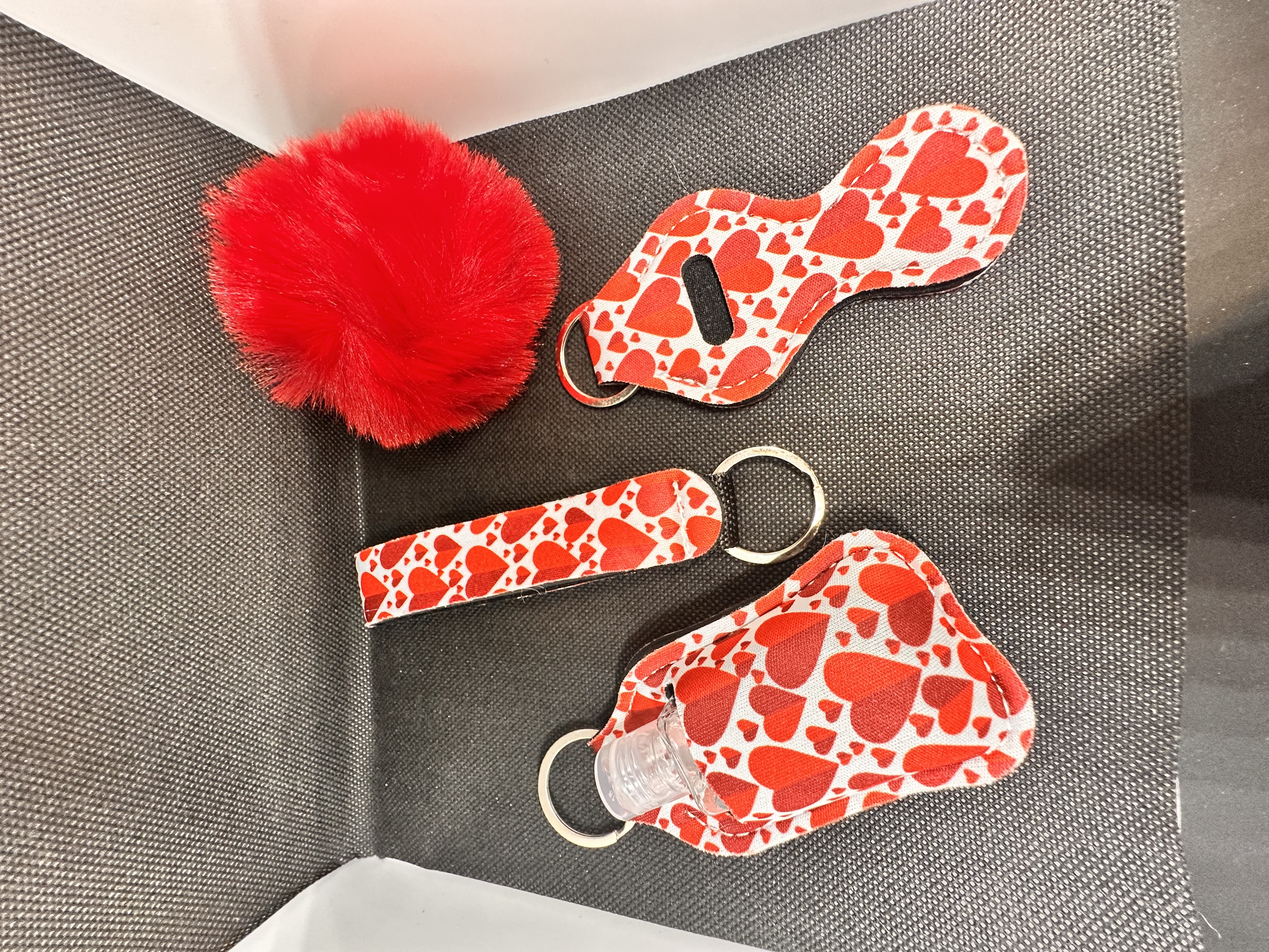 Lipstick holder/reusable bottle keychain with pompom