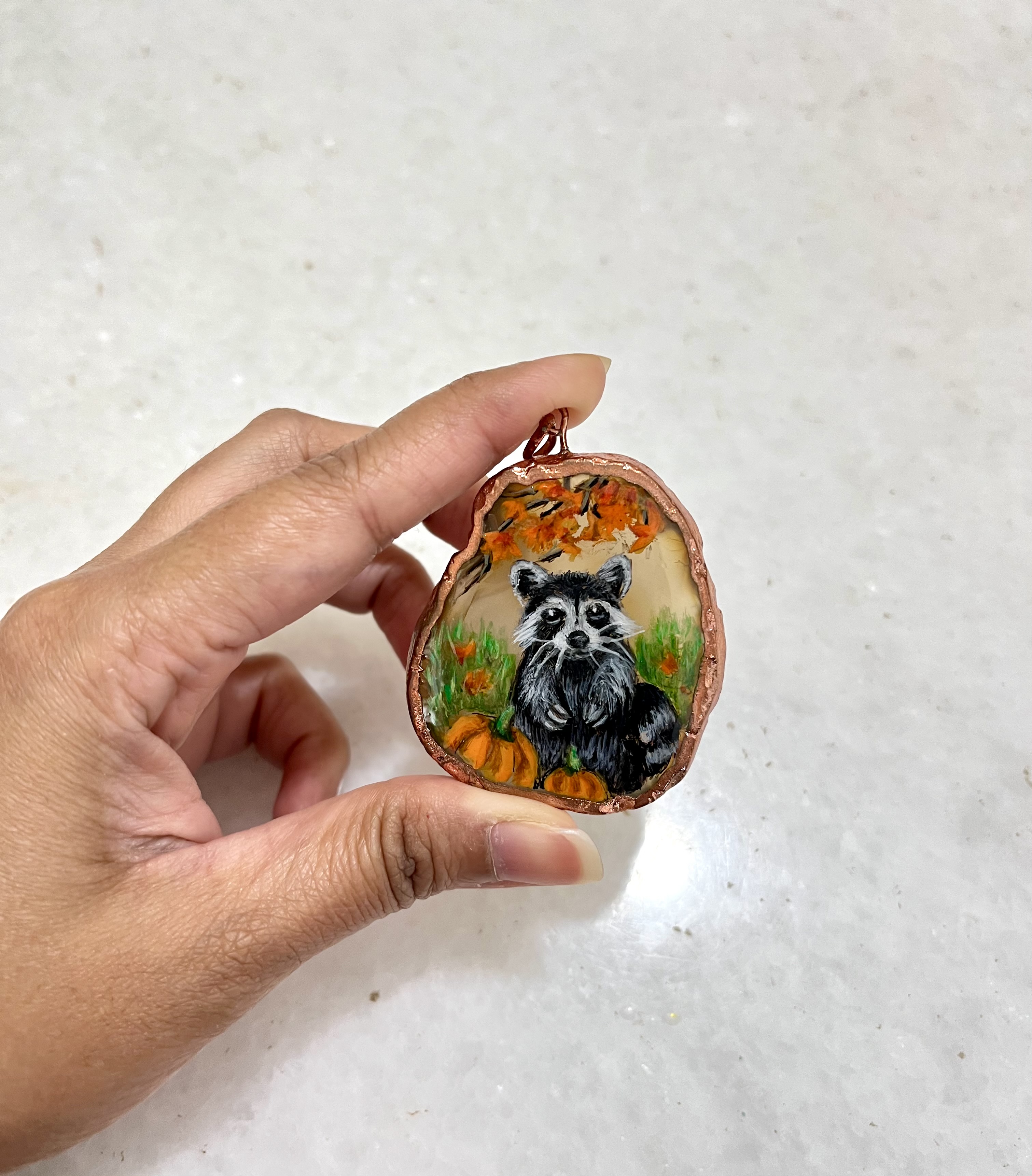 Hand-painted raccoon pendant