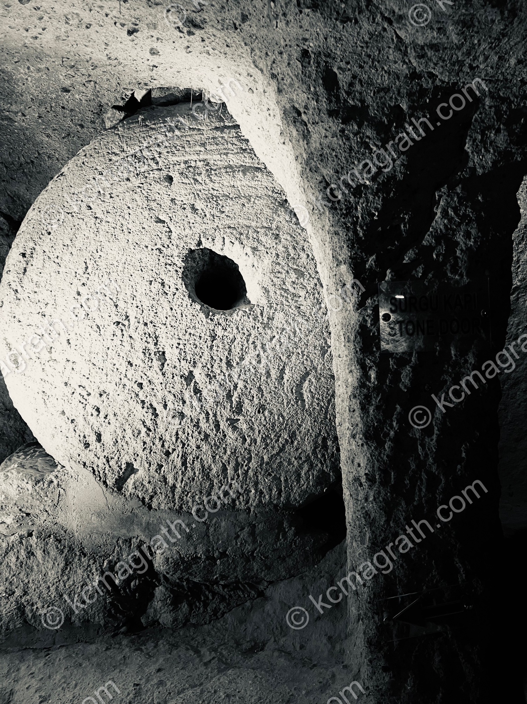 Ancient Heavy Round Stone Door in Cappadocia's Underground City, B&W, Turkiye