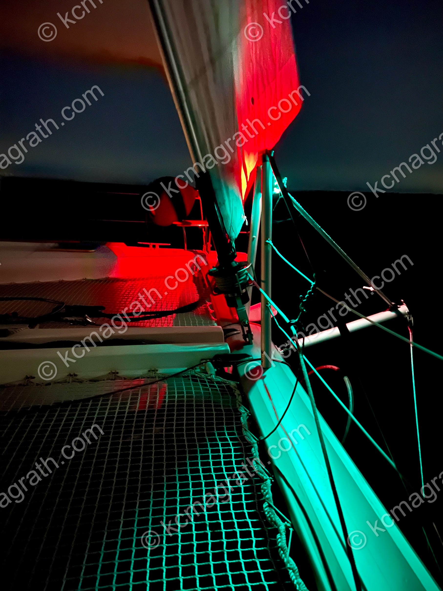 S/V Desert Rose, Nighttime Shot With Red & Green Nav Lights Resembling Flower, Abstract