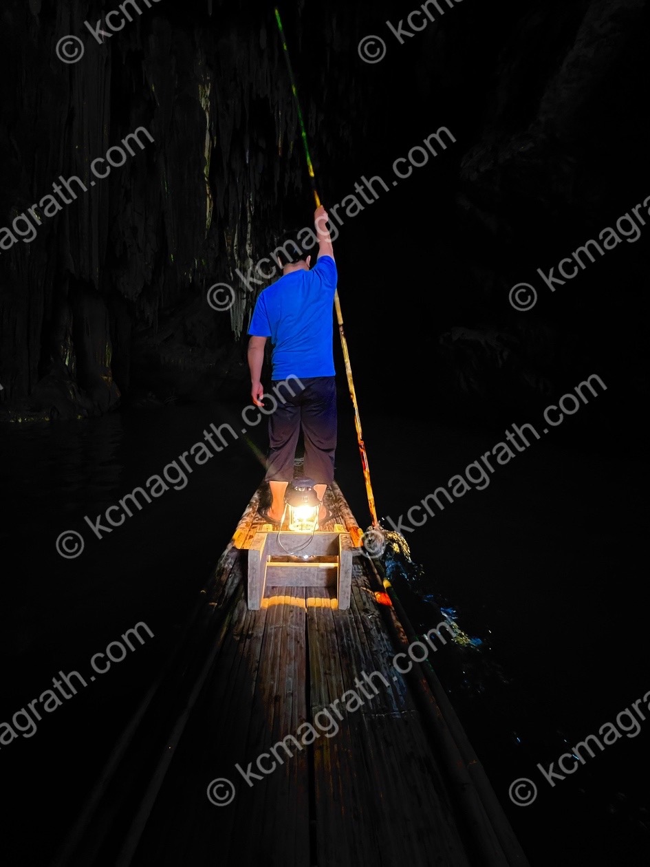 Bamboo Boat Poler in Cave, Thailand