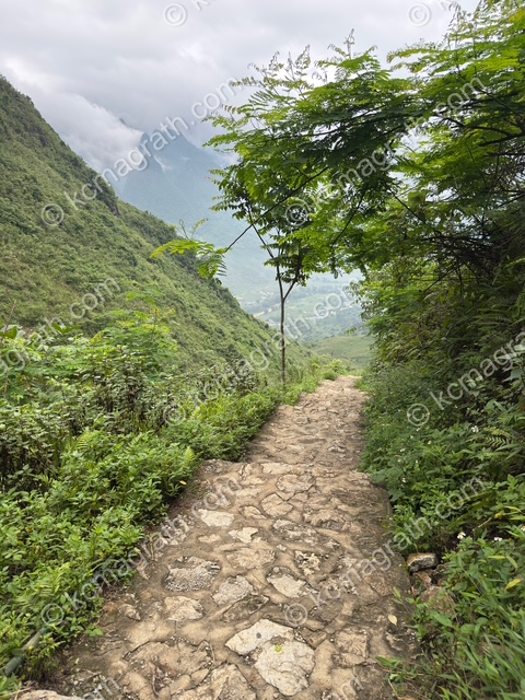 Quan Ba's Dong Ha Steps Through Mountain Pass to Cave, Vietnam
