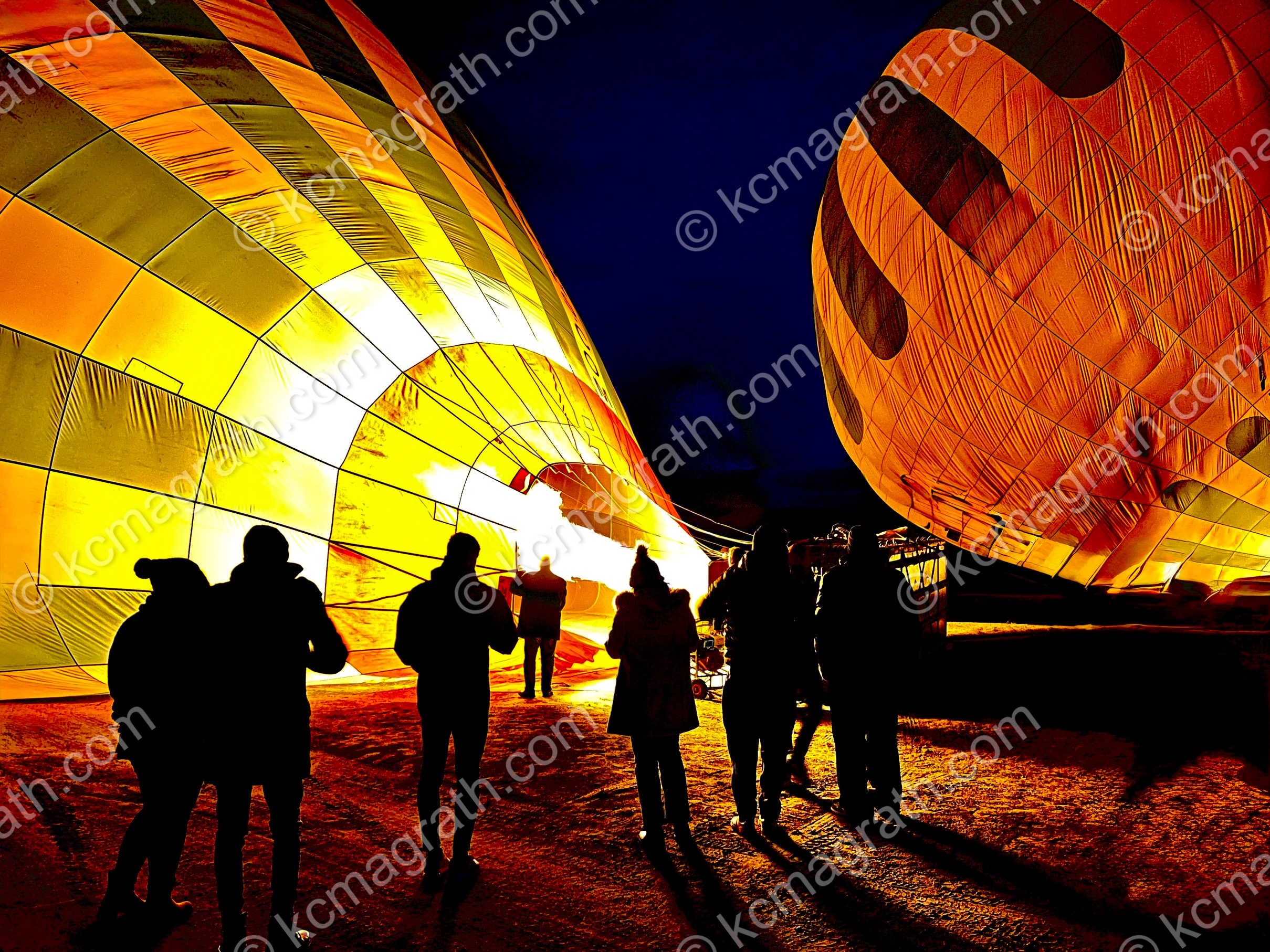 Kapadokya's Sunrise Hot Air Balloons 1 Inflating with Silhouettes of People, Turkiye
