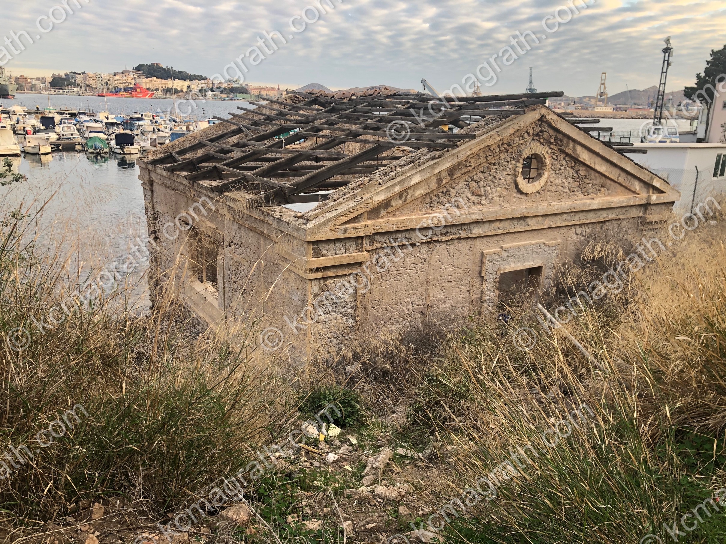 Cartagena's Small Marina Between the Two Lighthouses (Faro De Navidad & Faro De La Curra) & a Dilapidated house, Spain