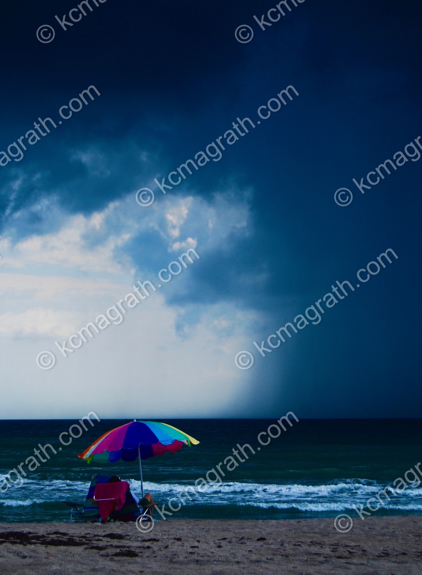 Florida's Beach With Umbrella and Approaching Squall, USA