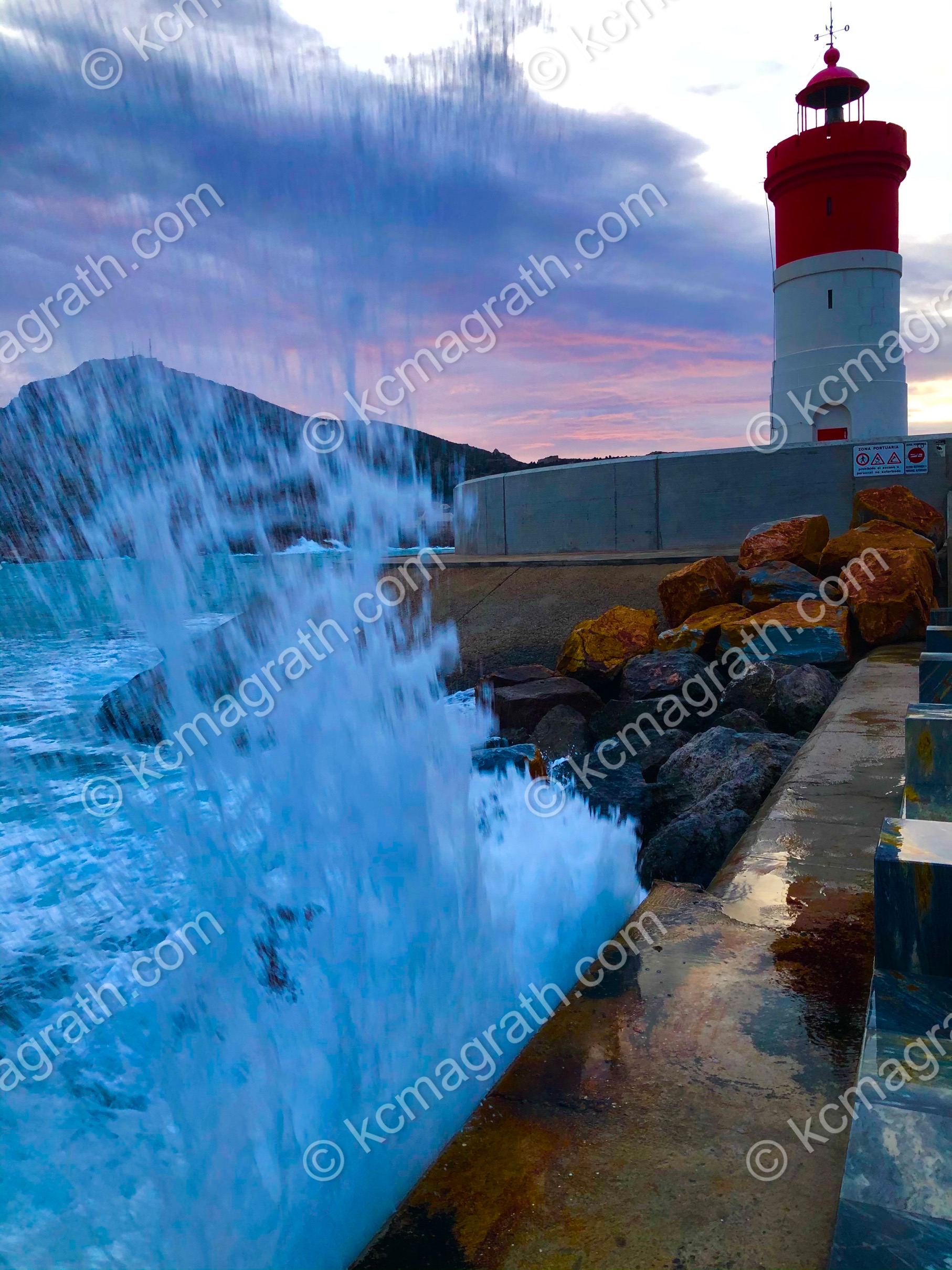 Cartagena's Faro De Navidad Red Lighthouse at Sunrise 2 With Big Splash, Spain