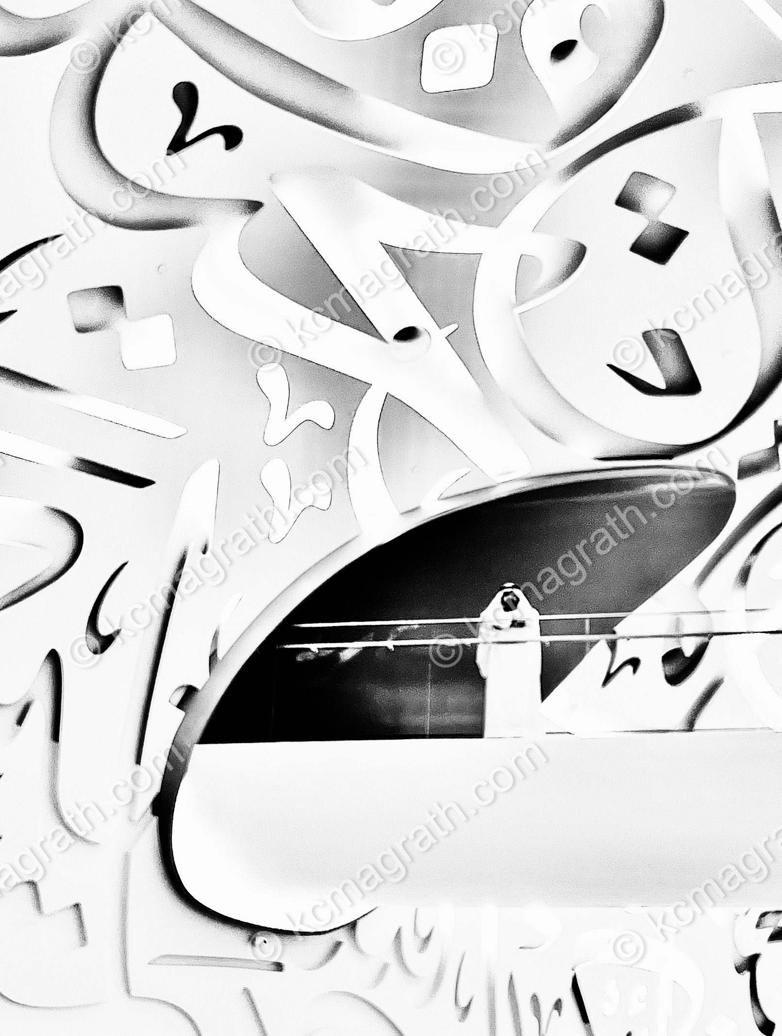 Emirati Wearing the Pure White Thobe (DishDasha) Amid Arabic Calligraphy, B&W, Dubai, UAE