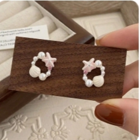 Pendientes de perlas con estrellas de mar