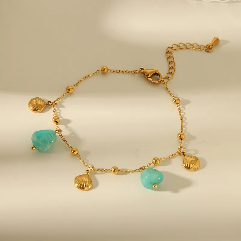 Pulsera dorada con dijes marinos