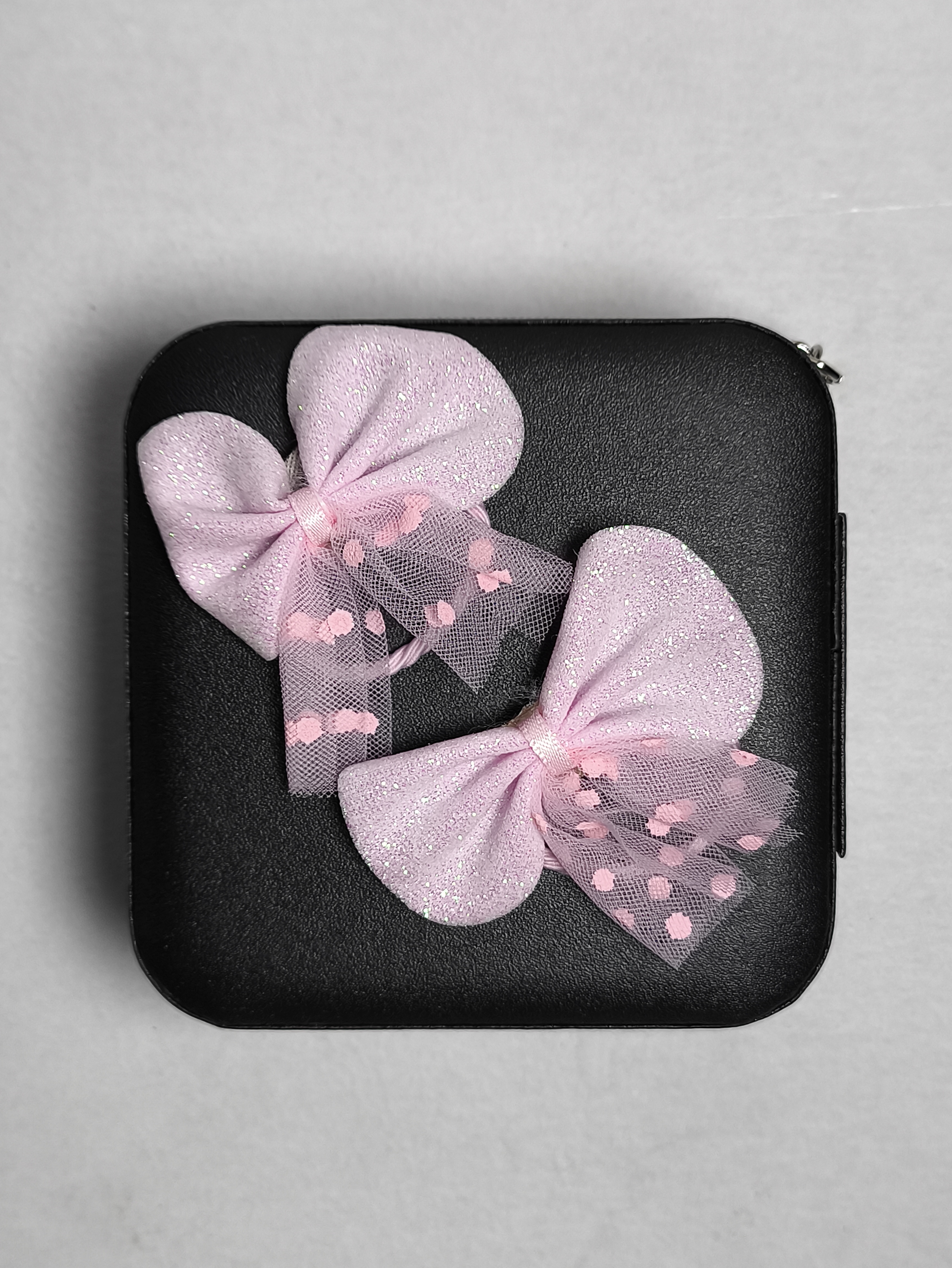 Par de lazos rosas para el cabello