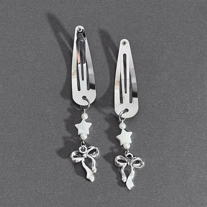 Par de horquillas decorativas con estrellas y lazos