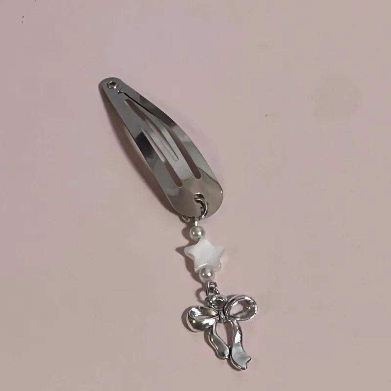 Par de horquillas decorativas con estrellas y lazos