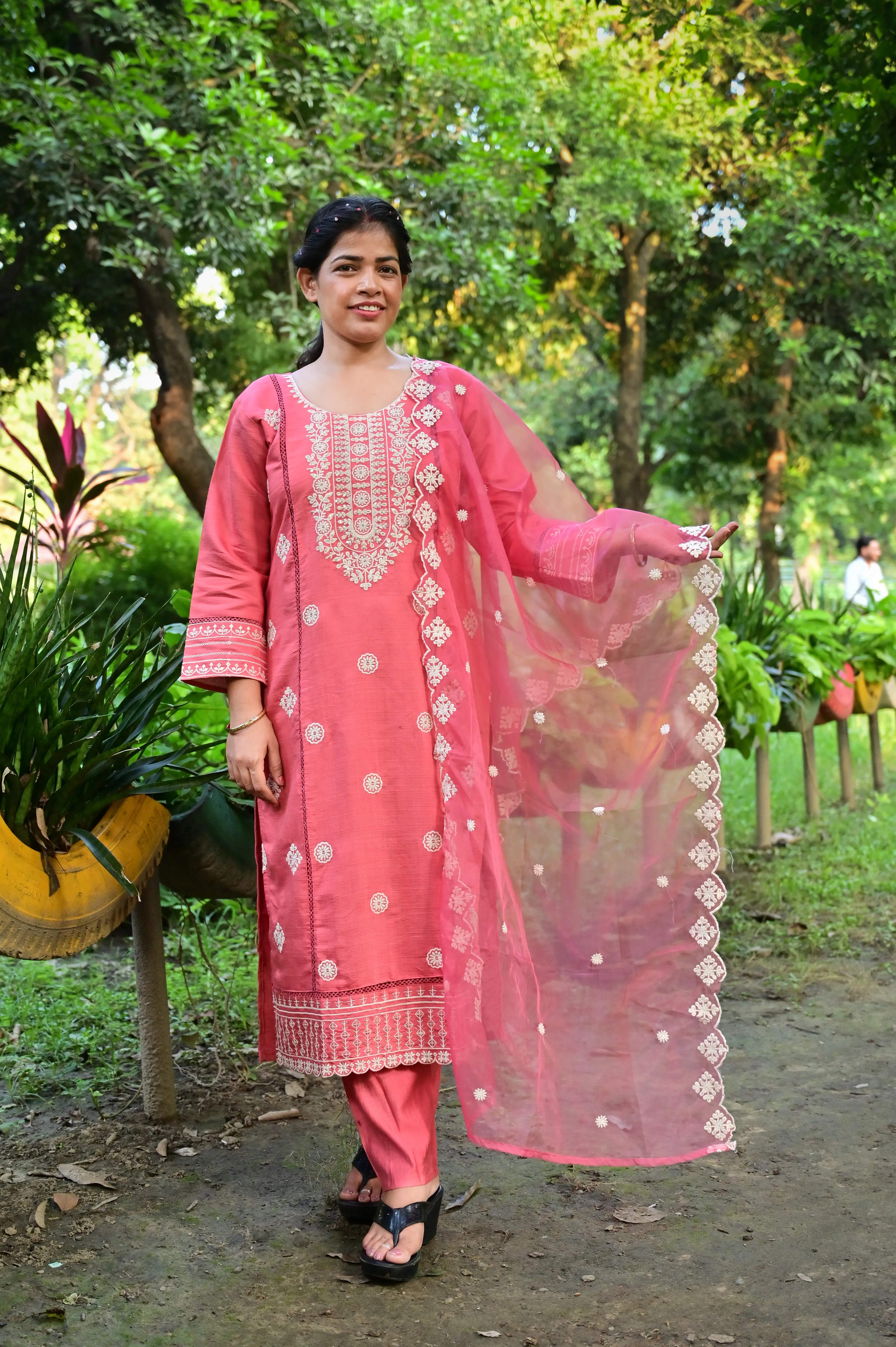 Elegant coral pink kurta pant set with embroidered details