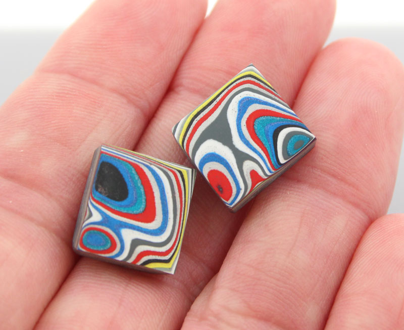 Hand cut Fordite matched pair of cabochons