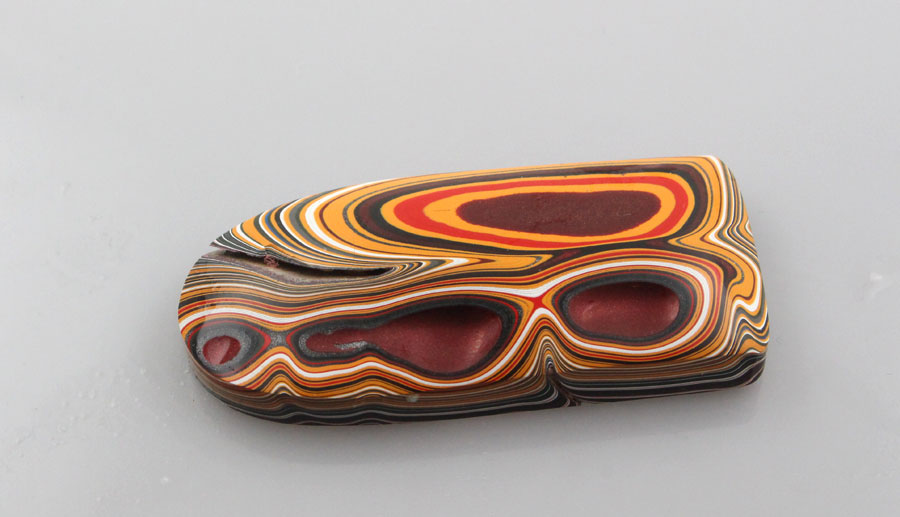 Hand Cut Rare Orange and Metallic Grey Sculpted top Jeep fordite