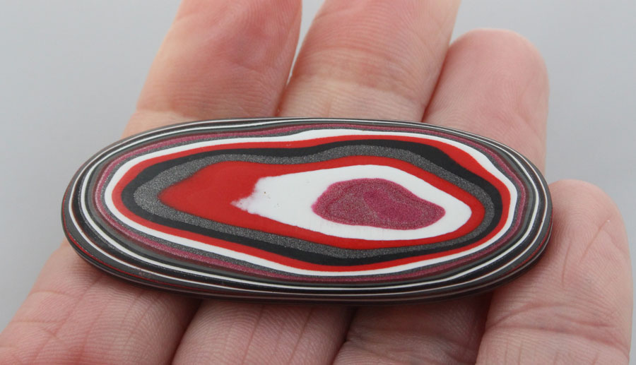Huge Hand Cut Metallic Red and Pink Jeep Fordite 