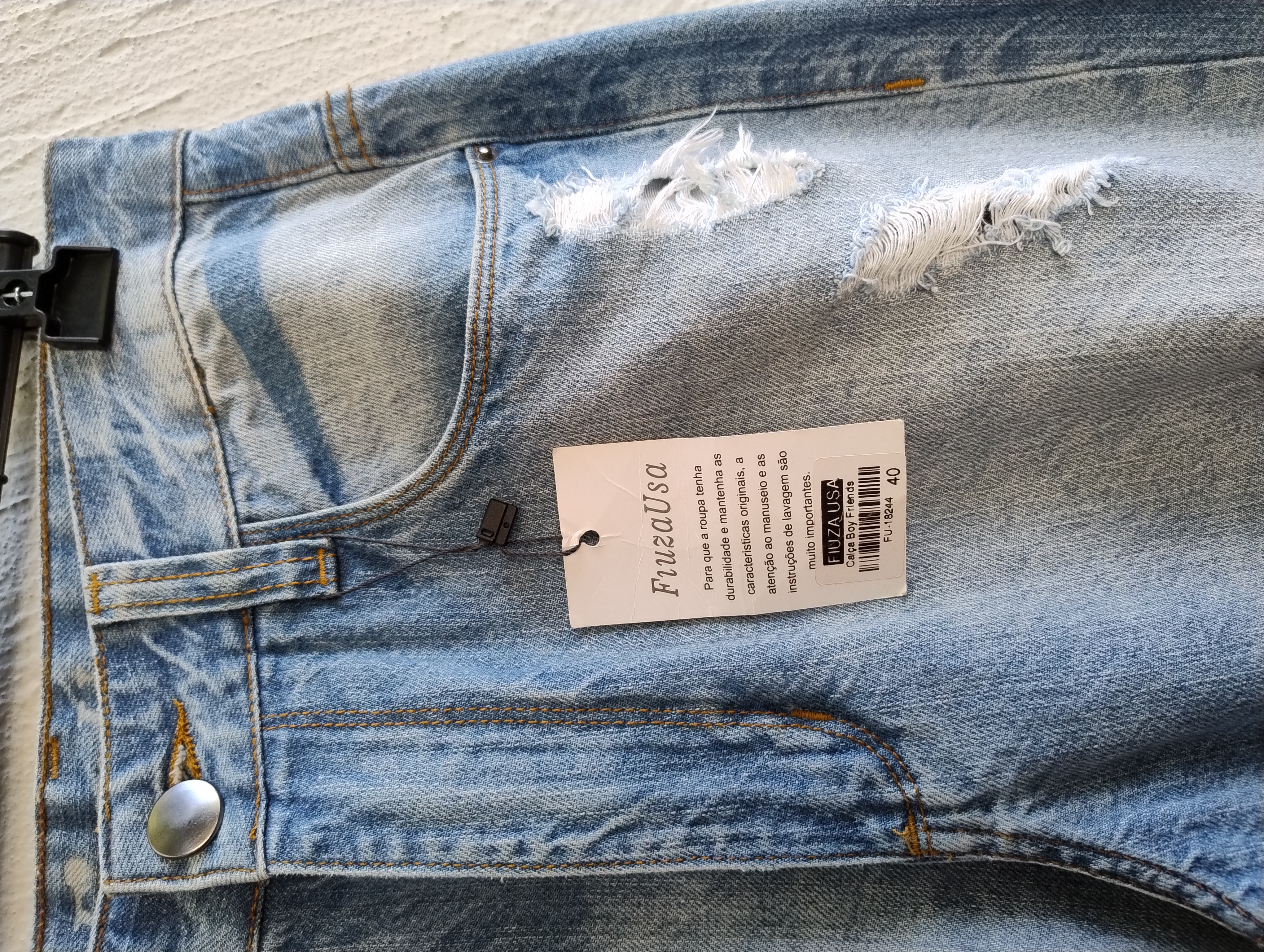 Calça Jeans Rasgada