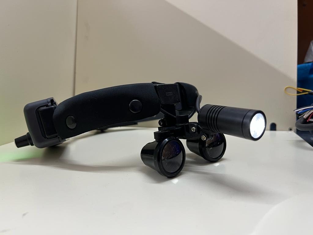 Head-mounted magnifier with LED light