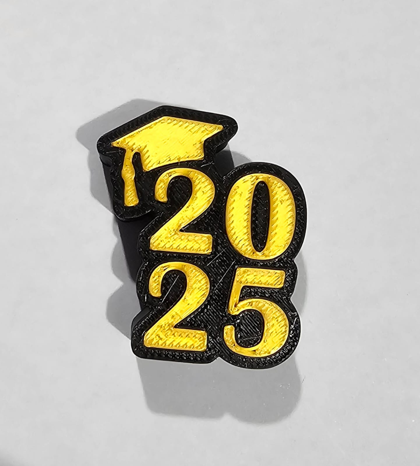 Insignia de graduación 2025