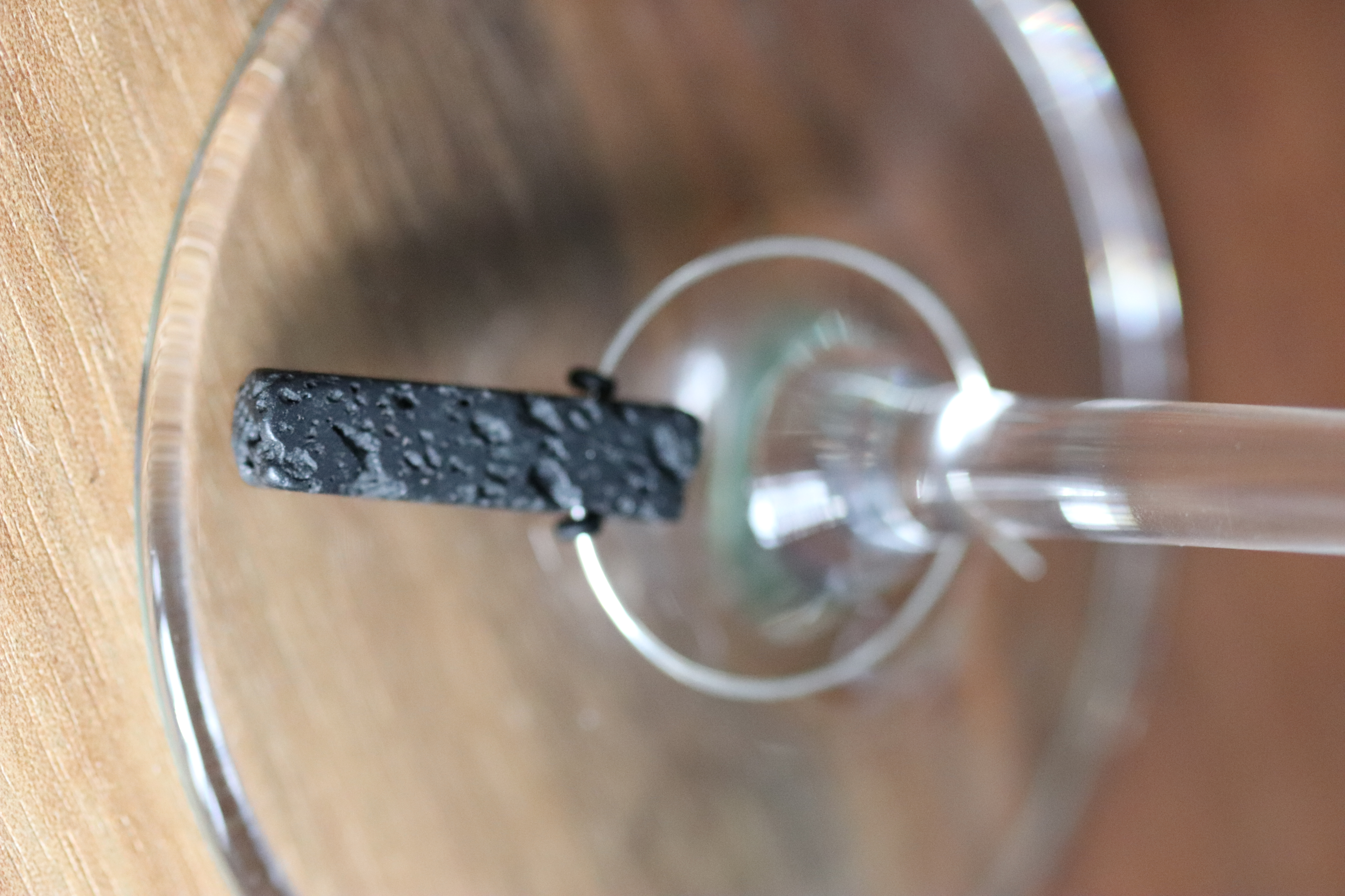 Stylish black lava stone bar shaped wine charm called "Tall Handsome Guy"