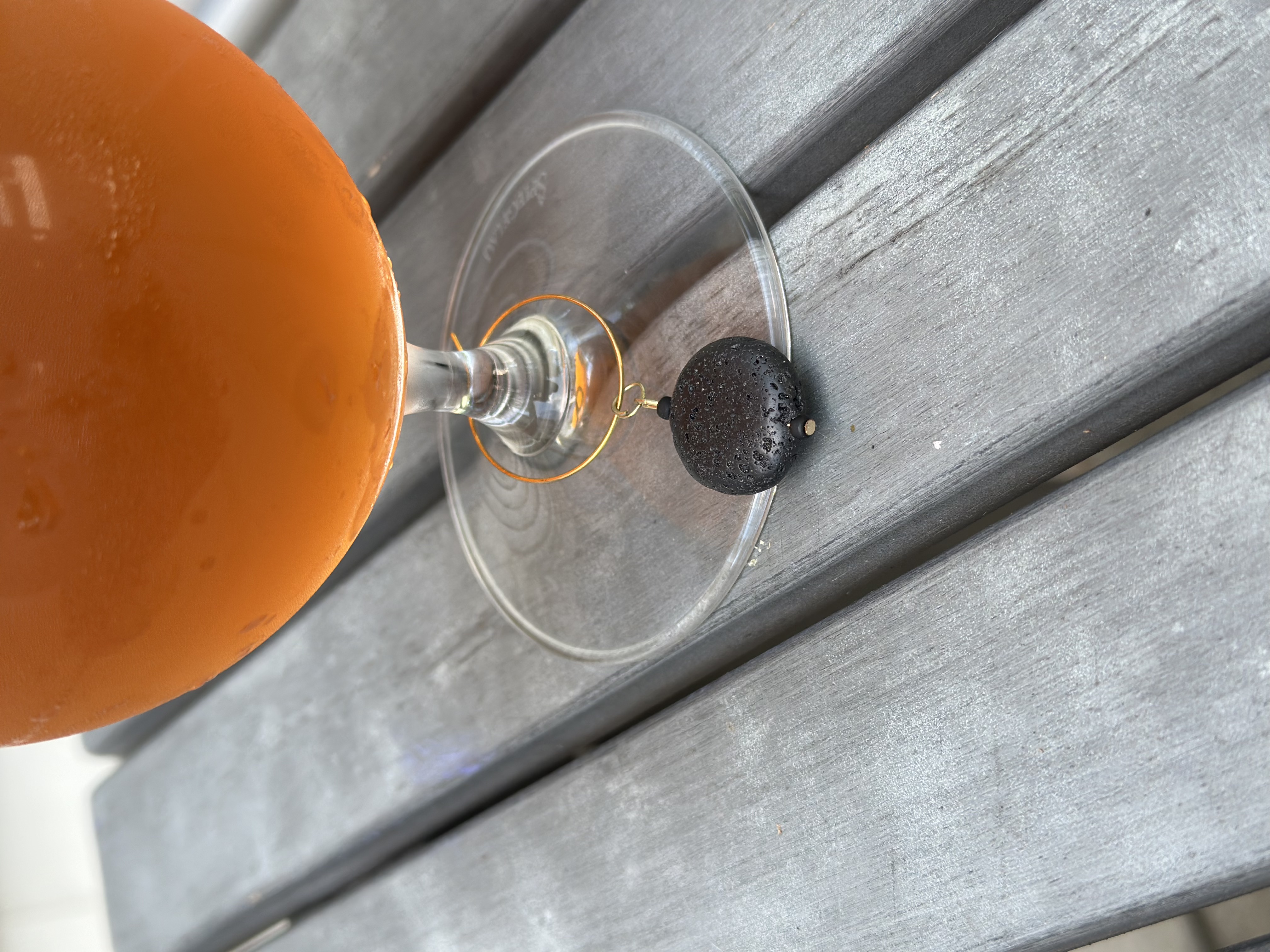 Black Lava Stone Wine Charm called "Solar Eclipse"