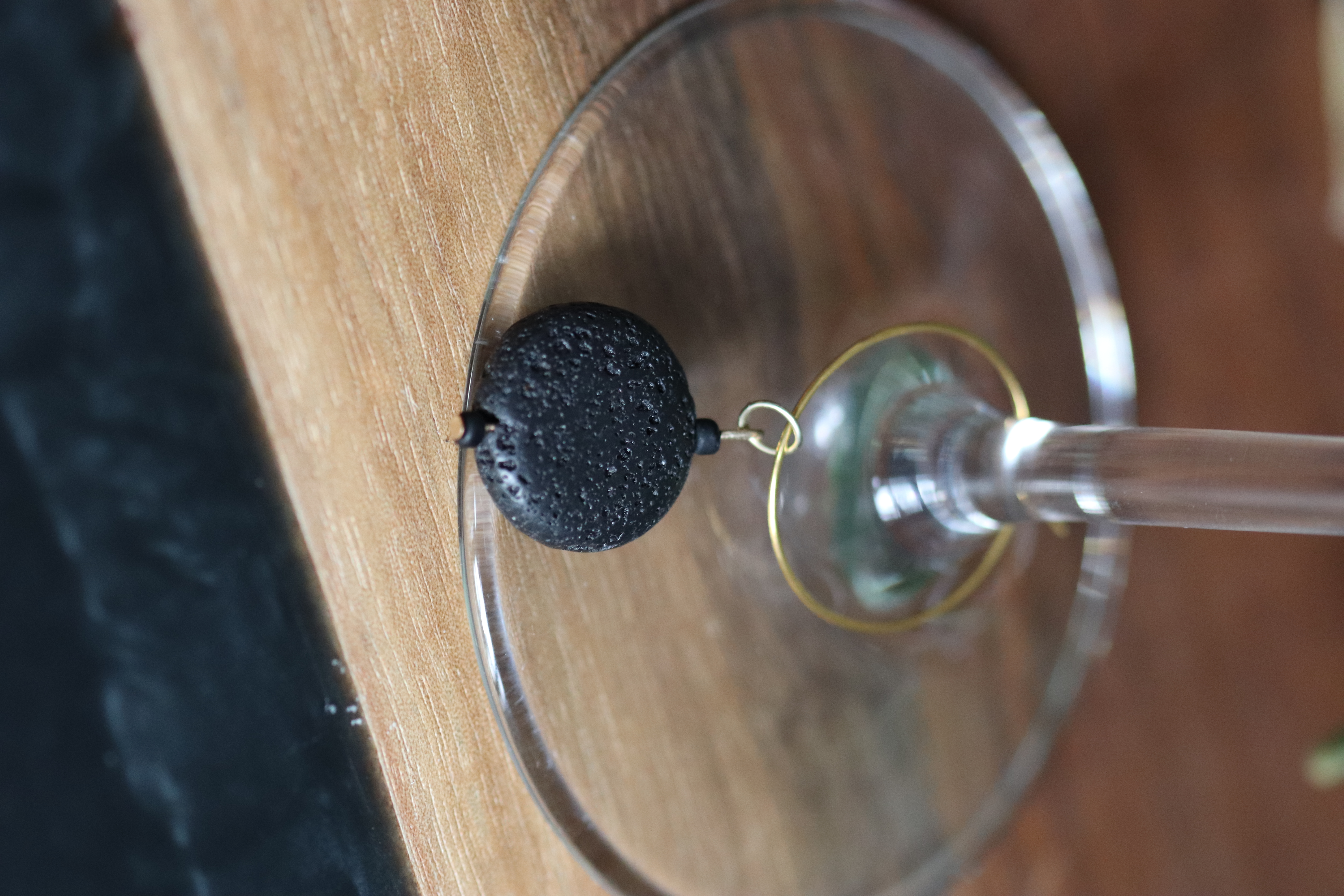 Black Lava Stone Wine Charm called "Solar Eclipse"